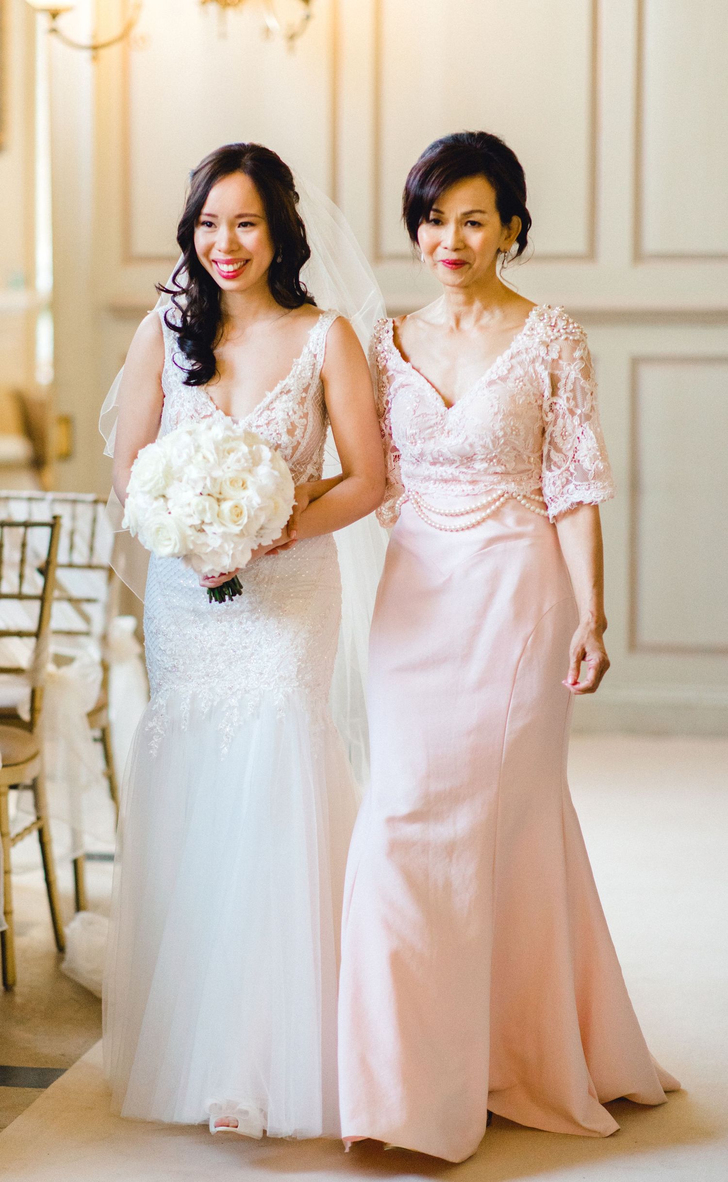 Bride walking down the aisle with her father - romantic chic wedding in Gosfield Hall Essex