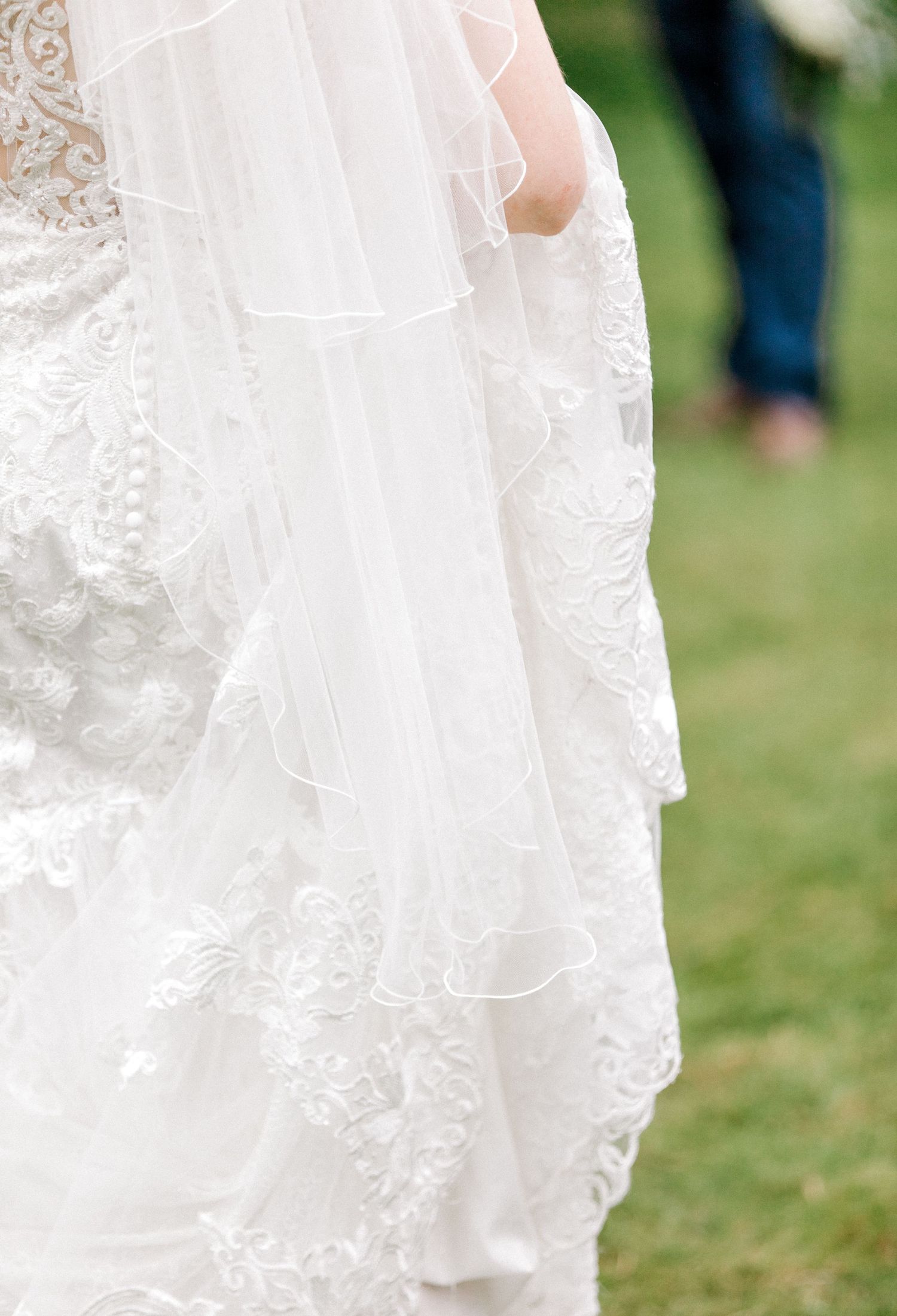 Detail shot of bride's dress and veil in Hoath House Edenbridge Kent