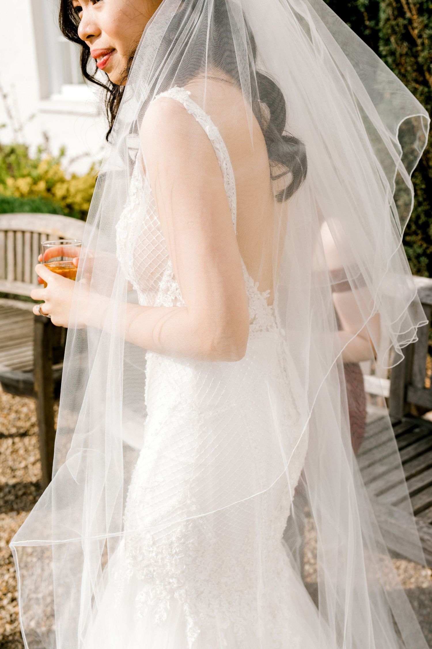 Detail shot of bride wedding dress and veil Gosfield Hall Essex