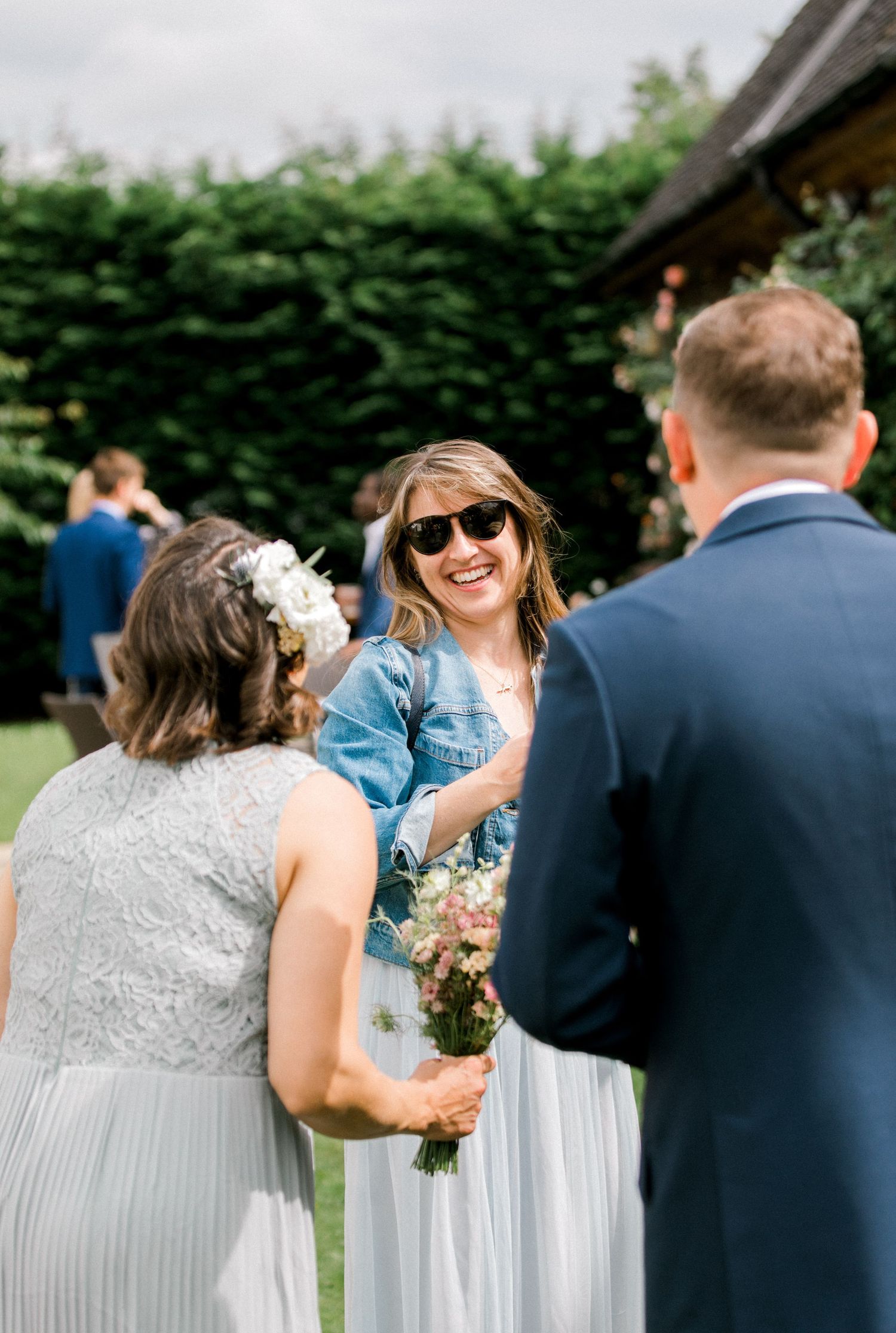 Candid photo of guests chatting during cocktail hour at London wedding