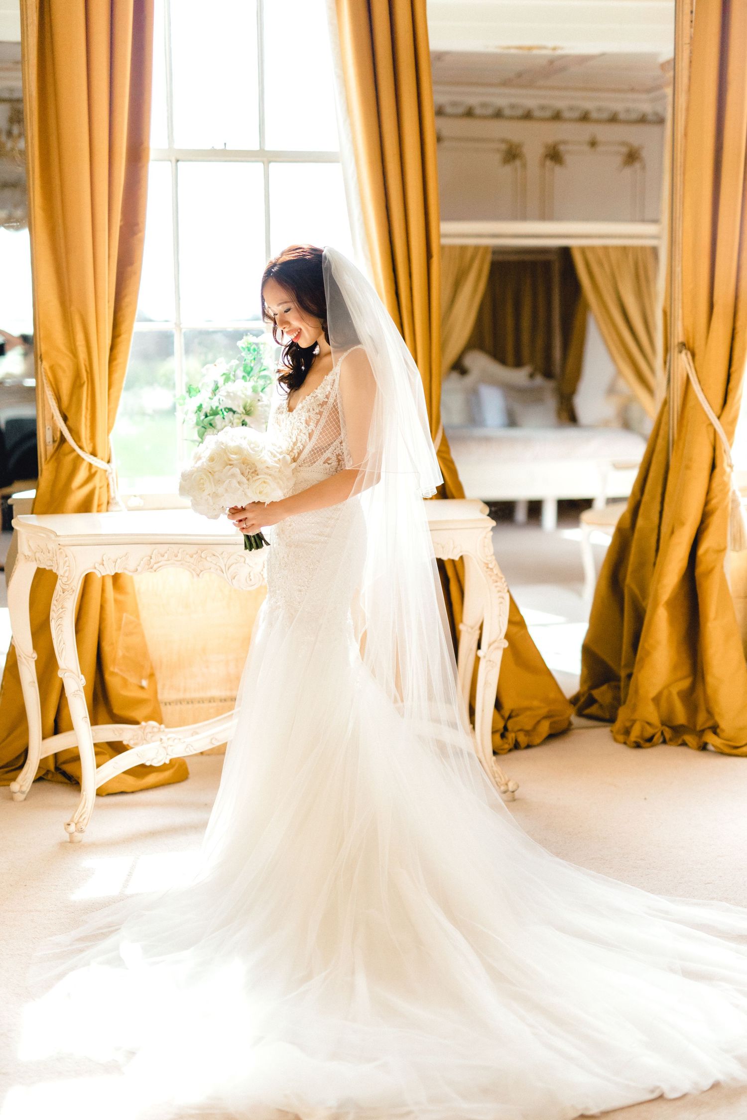Elegant bridal portrait in lace gown at Gosfield Hall – candid documentary style wedding photography