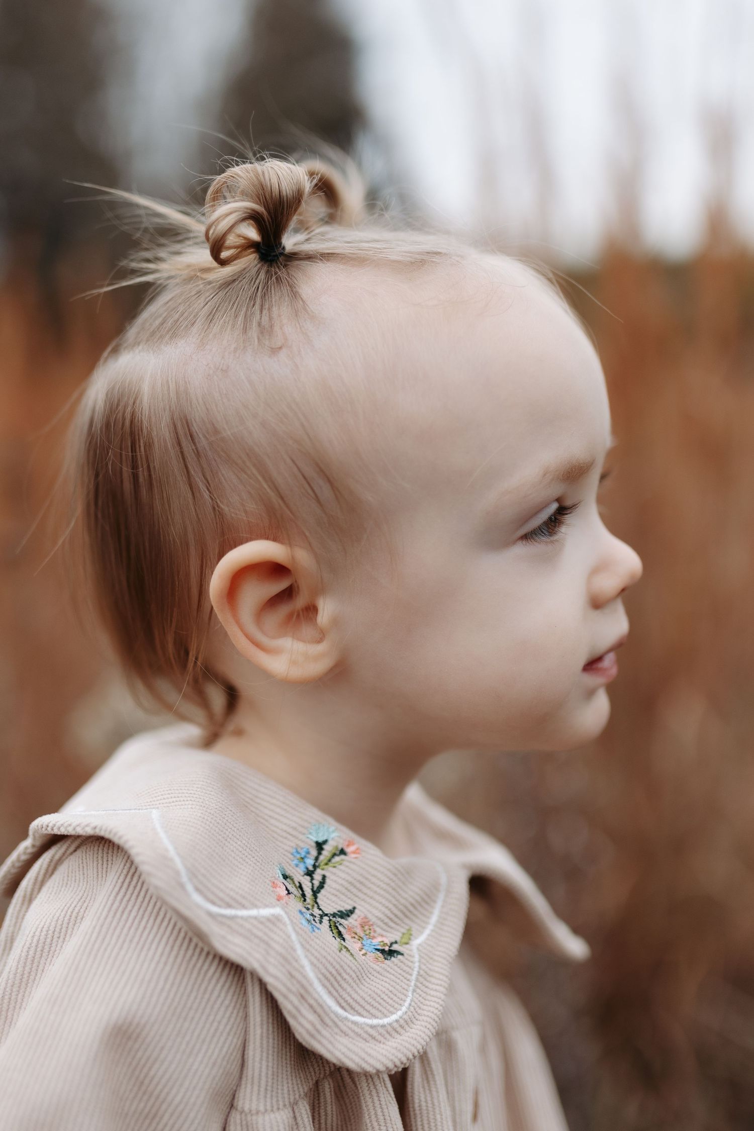 Side profile portrait series showing delicate details of a light-colored collar and hair against a soft blurred background.