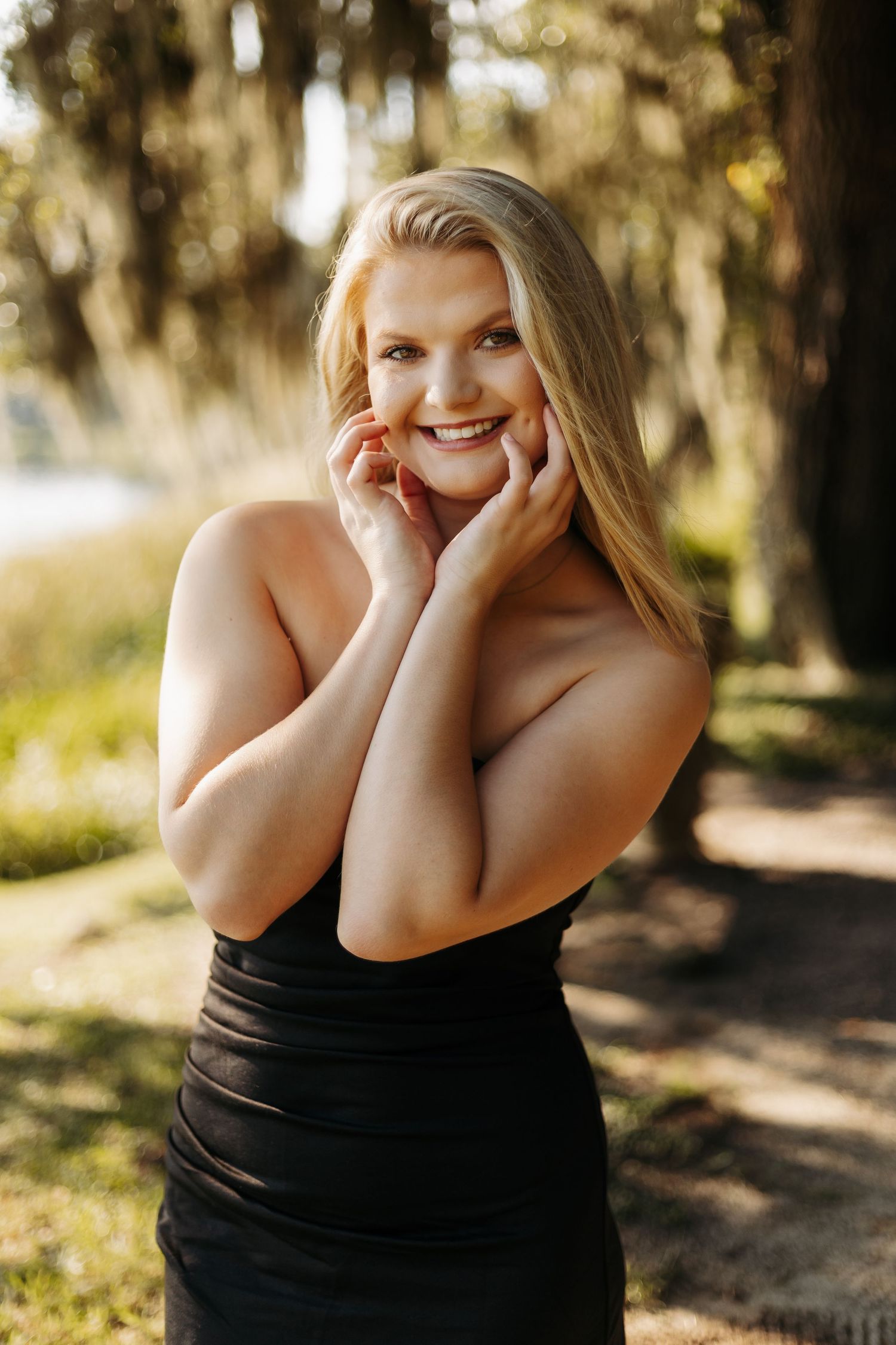 Playful portrait series showing joyful expressions in a wooded outdoor setting at golden hour.
