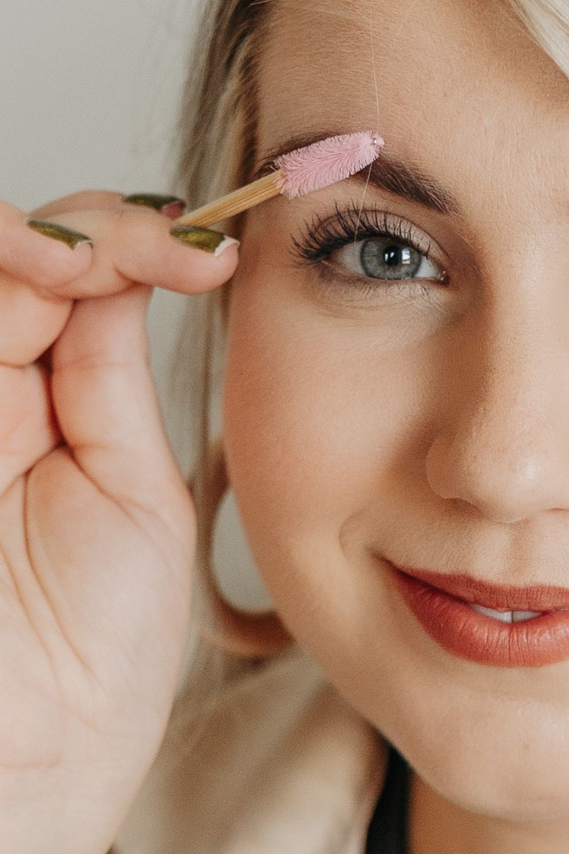 Close-up beauty shot showing eyebrow grooming and makeup application in a series of steps.