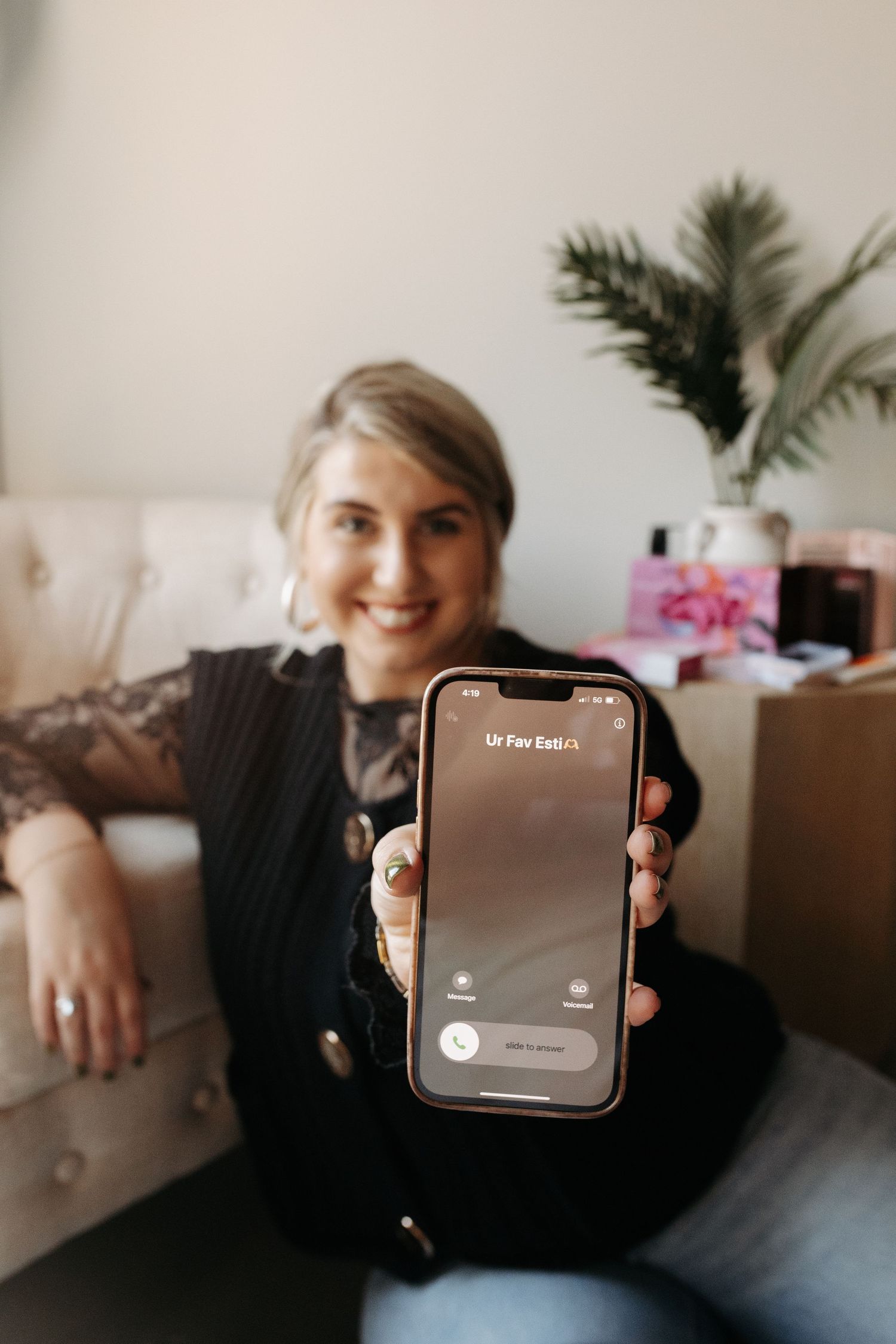 A series of photos showing someone holding up an Apple Watch device while sitting on a couch with plants in background.
