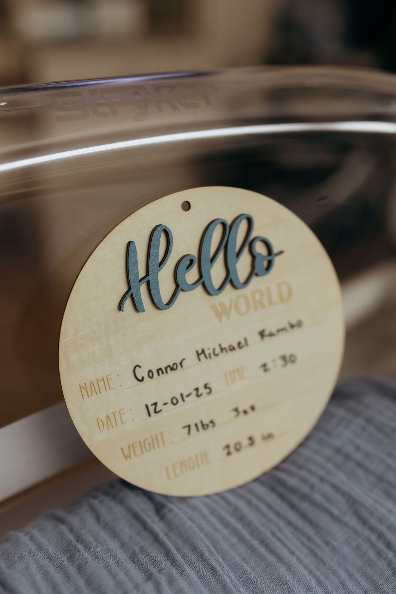 Wooden Hello World birth announcement sign for Connor Michael Rambo, born 12-01-25, 7lbs 3oz, 20.3 inches.