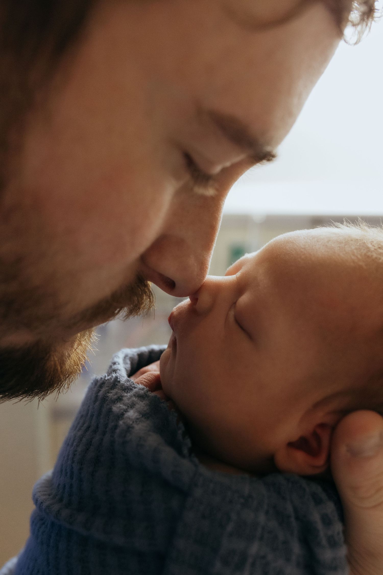 A tender moment captured in a series of close-up photos showing gentle affection and intimacy.