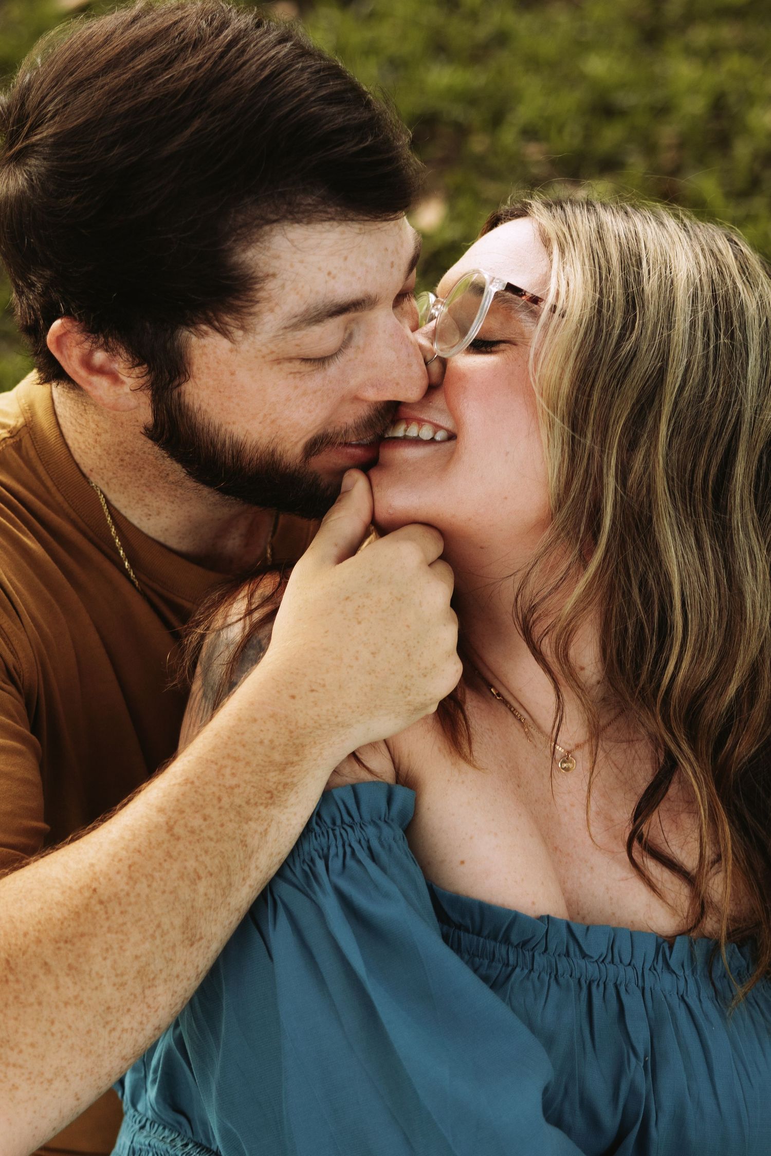 A romantic sequence of progressive kissing photos showing a couple in a brown shirt and blue shirt embracing.