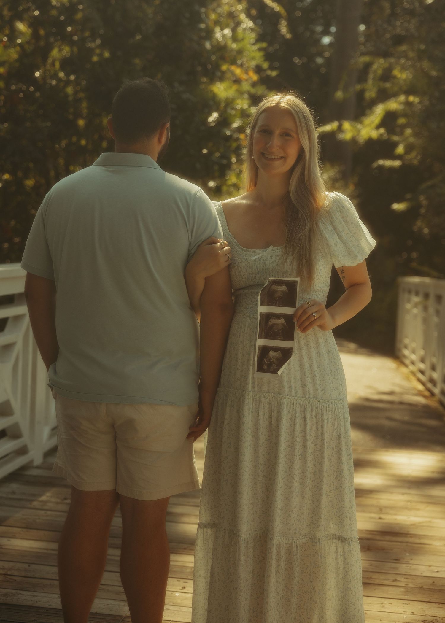 A series of romantic outdoor photos showing a couple in casual attire embracing on a sunlit wooden deck.