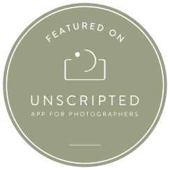 A circular sage green badge logo for Unscripted app featuring a minimalist camera icon design.