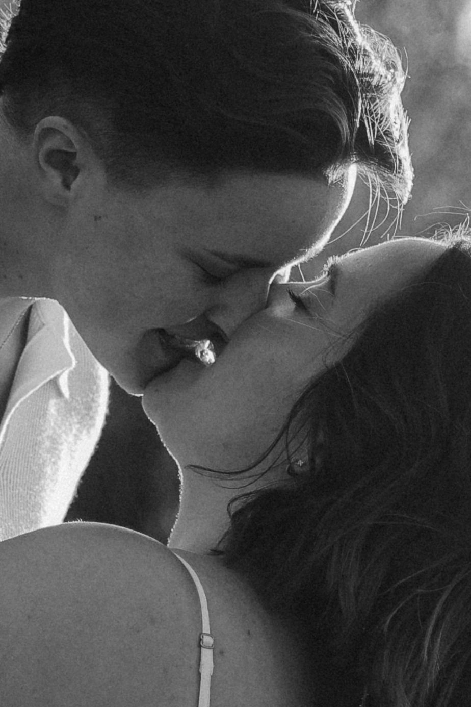 Black and white portrait sequence capturing intimate moments between a couple.