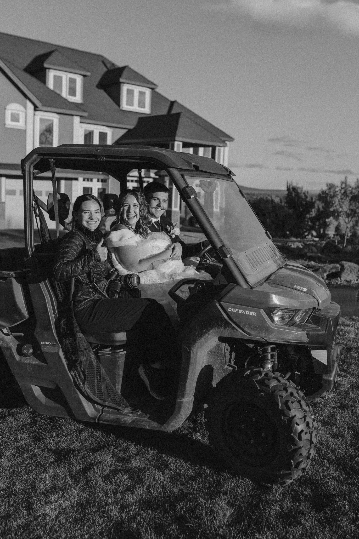 People enjoying a ride in an off-road vehicle through hilly terrain.