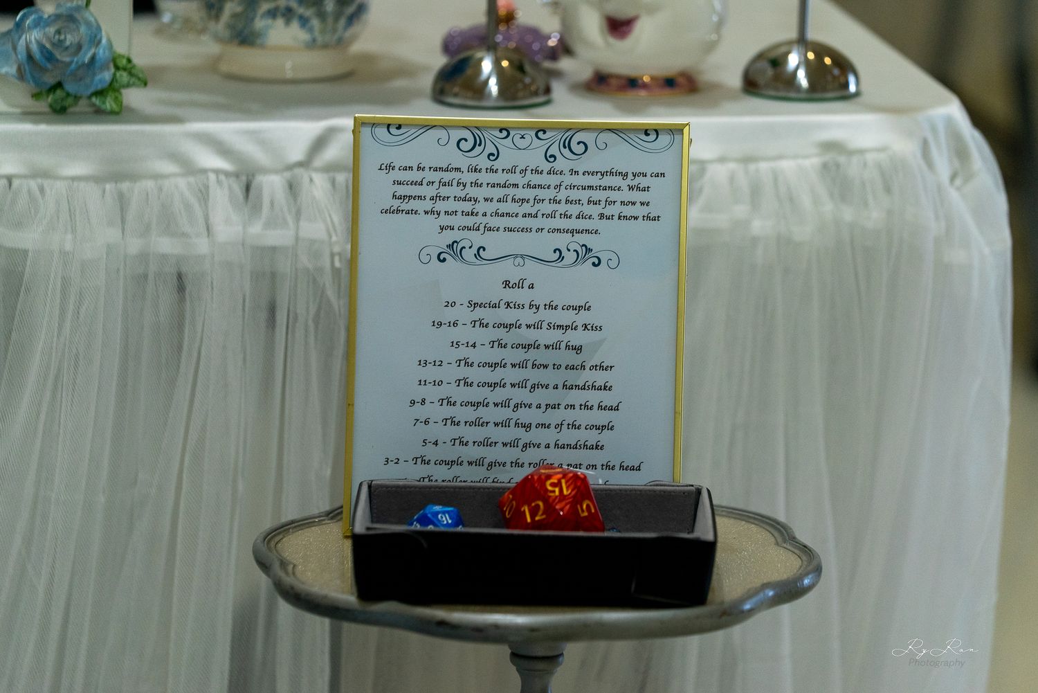 Close-up of framed menu card on silver tray at formal event setting.