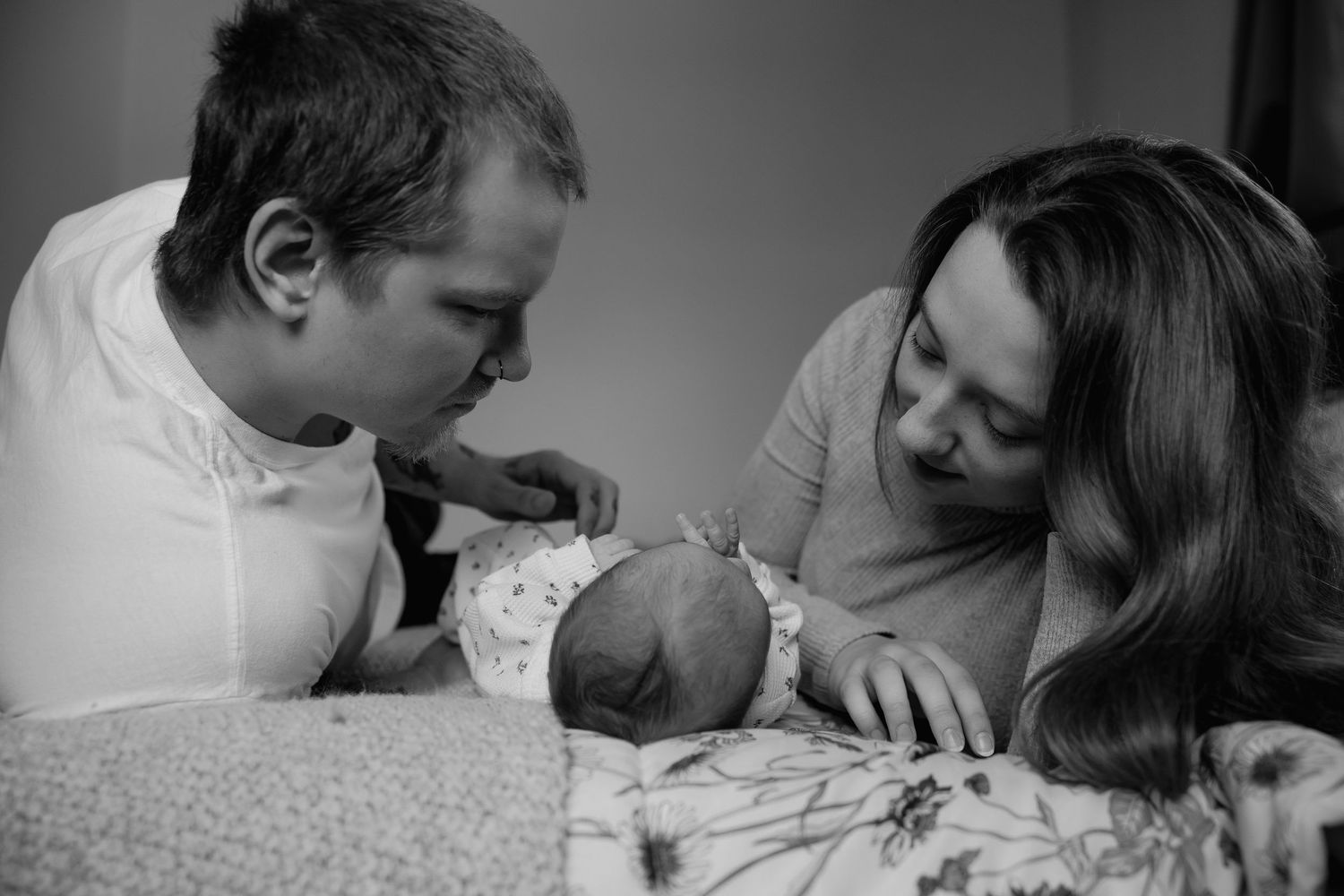 A collection of black and white photographs showing intimate moments of affection and connection between couples.