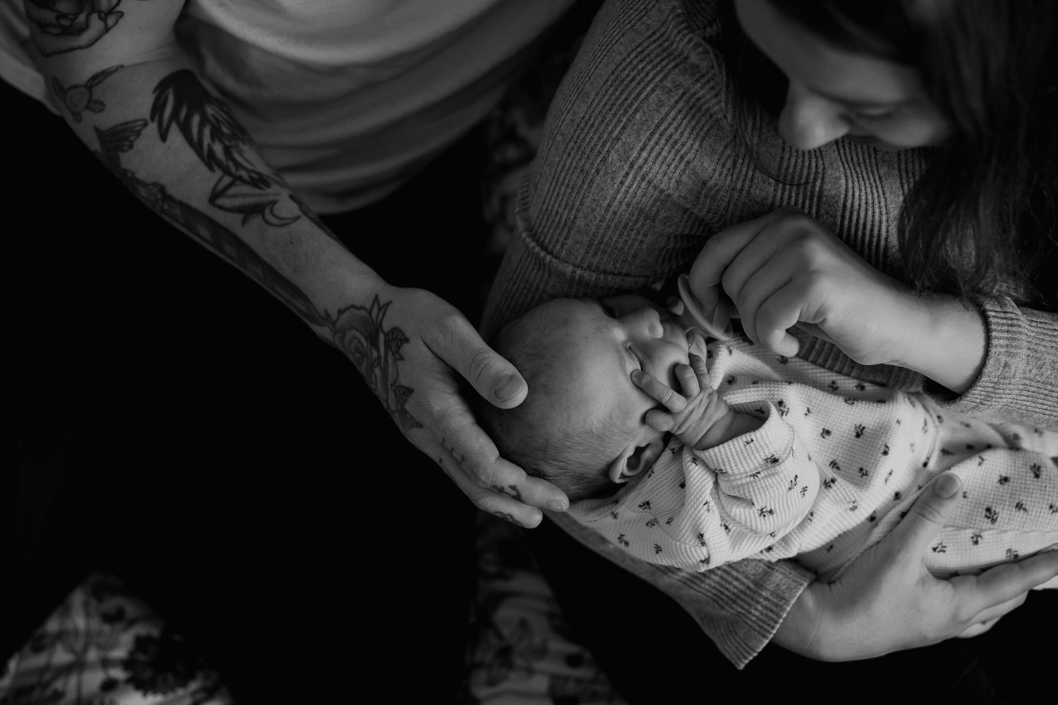 A series of black and white photos showing hands playing cards in a dimly lit setting.