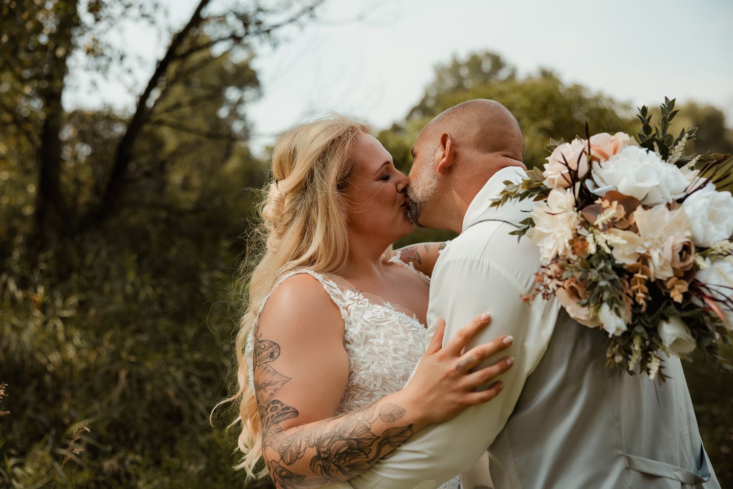 Romantic wedding moment captured in a series of intimate outdoor photographs showing couple embracing in natural light.
