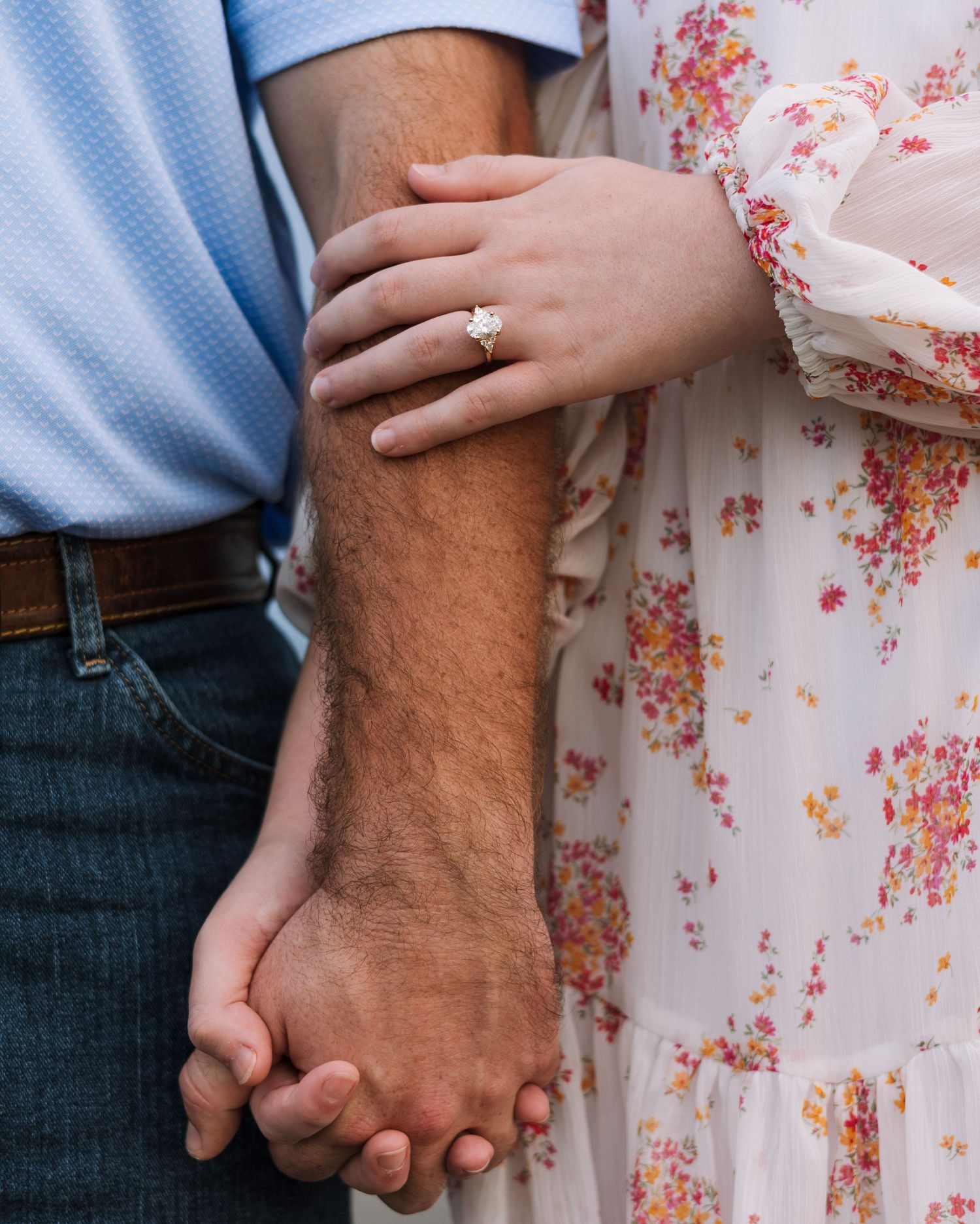Close-up shots of hands holding each other showing tender moments of connection.