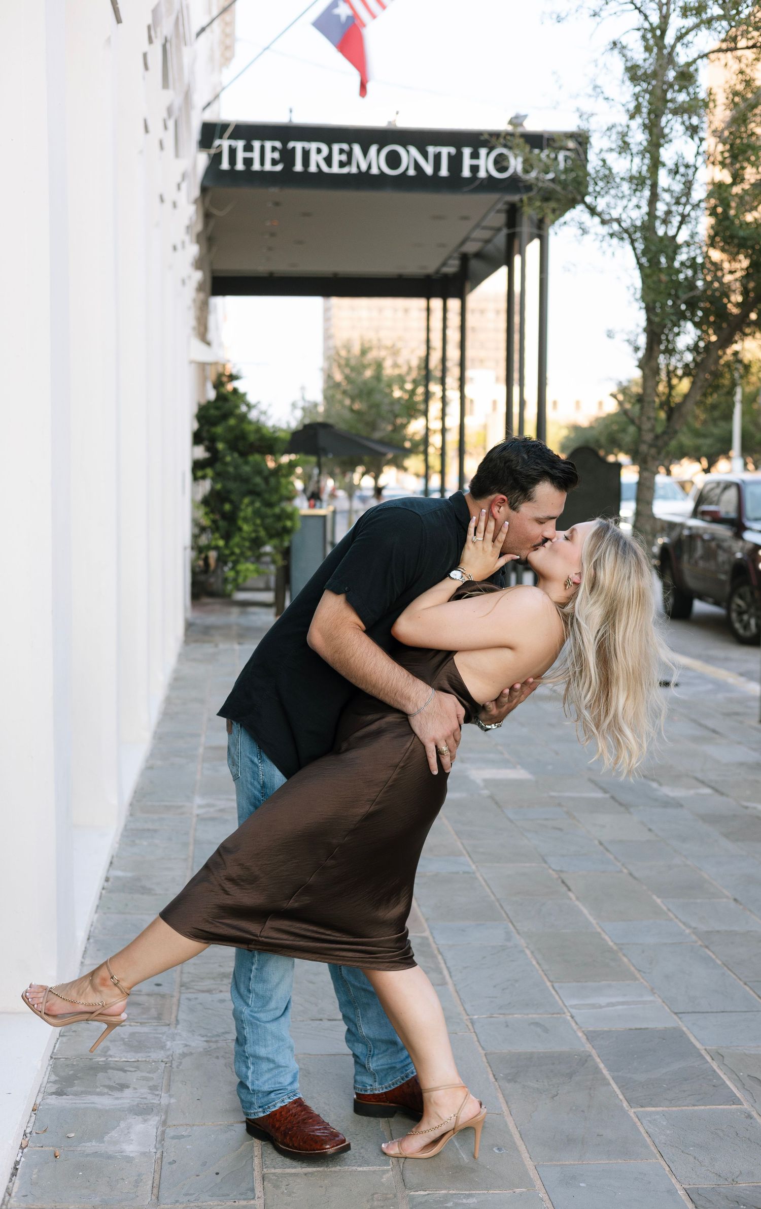 Romantic dip kiss in front of The Tremont House.