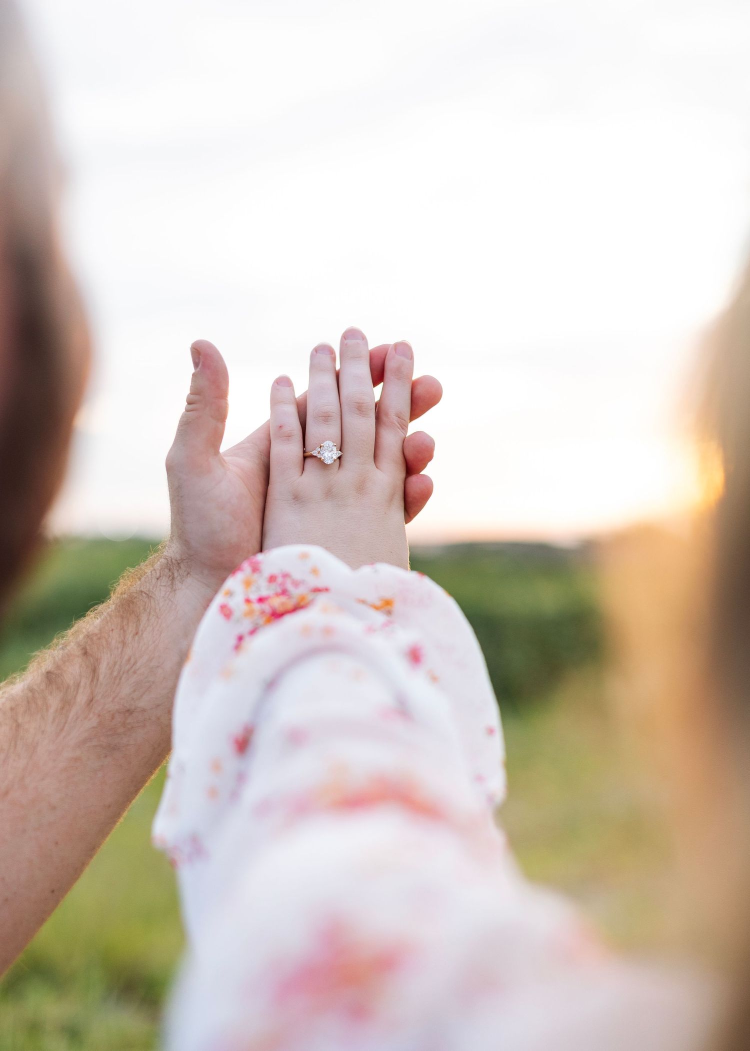 A series of romantic hand-holding moments captured against a bright outdoor background.