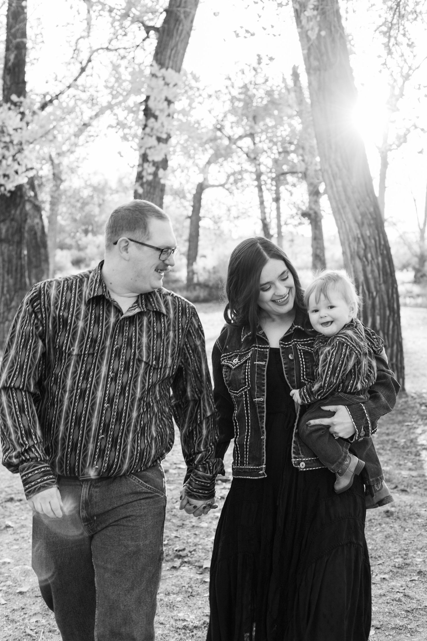 mom and dad looking at baby