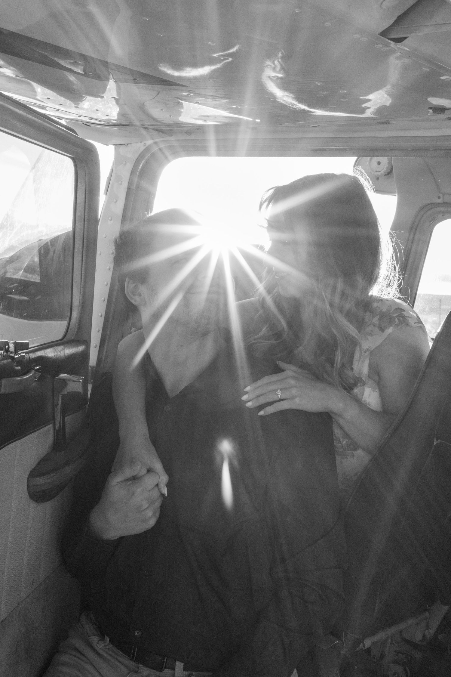 couple poses in cockpit