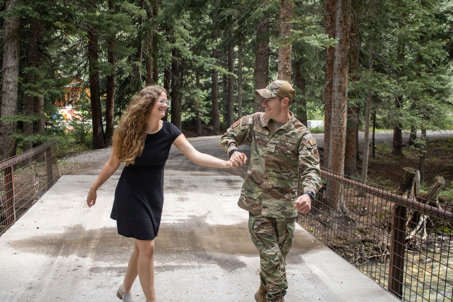 couple walking over bridge