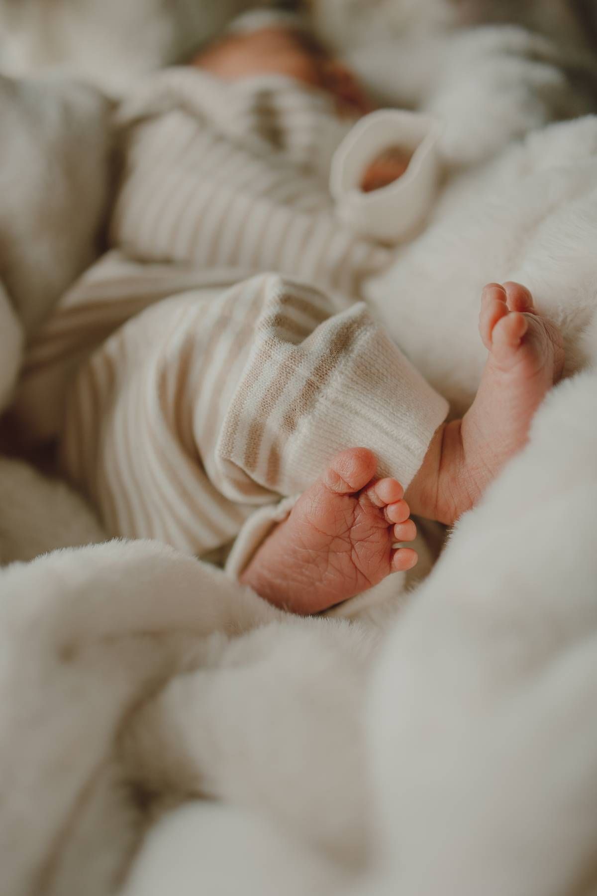 Close-up of tiny newborn feet photographed during a Dallas Fresh 48 photography session.