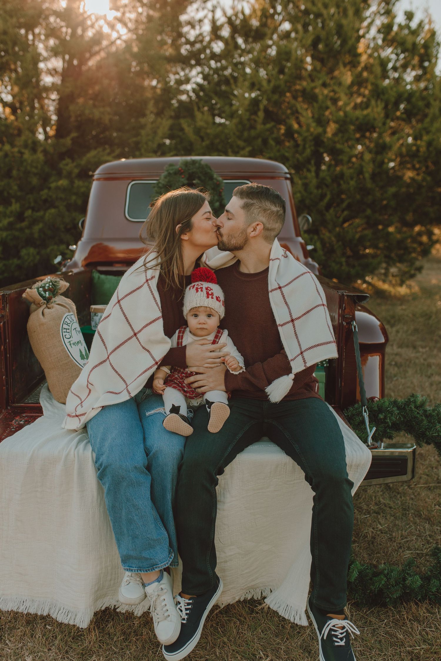 Vintage red truck holiday photo session with classic Christmas decor and cozy family photography