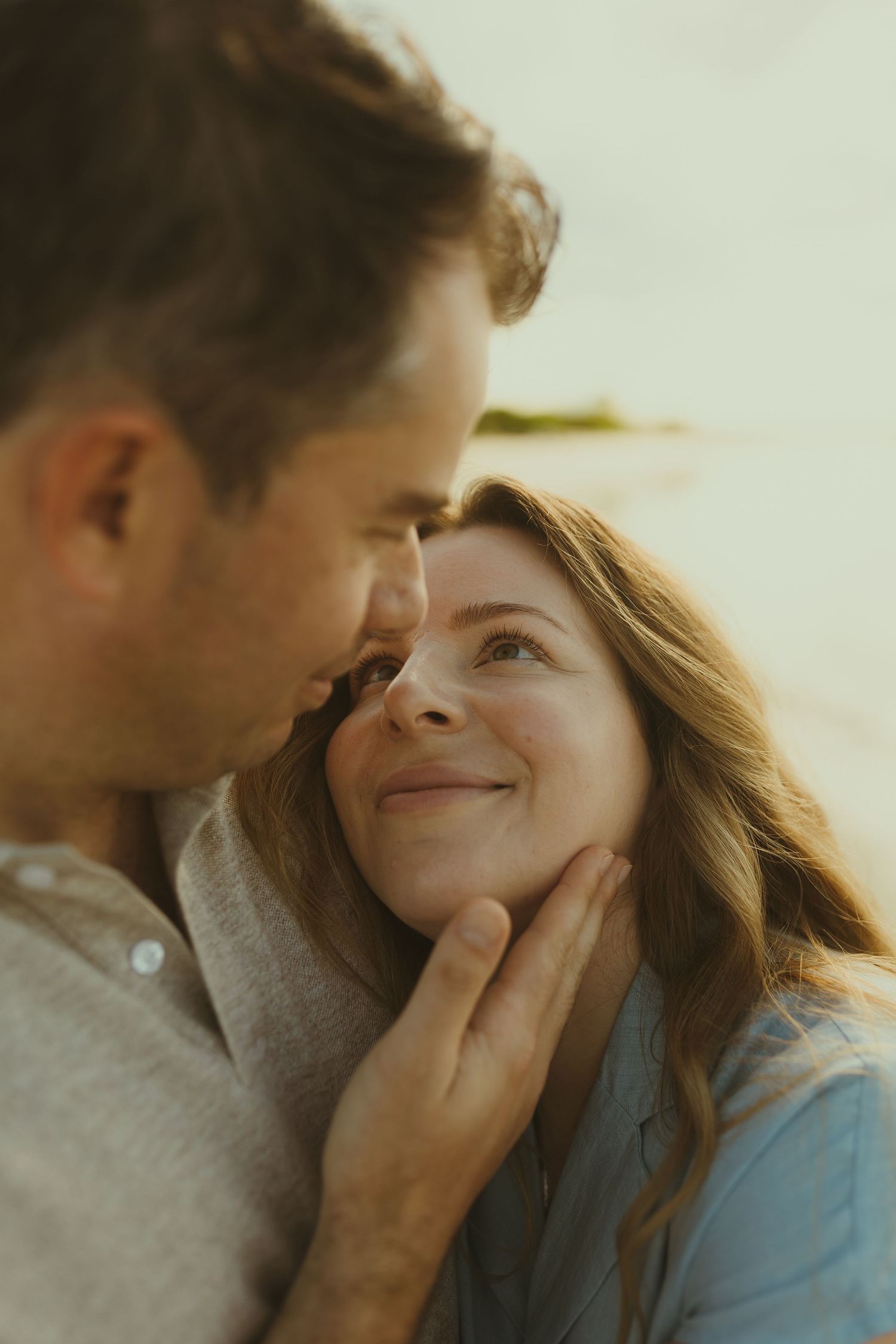 Intimate close-up photo series showing tender romantic moments between a couple.