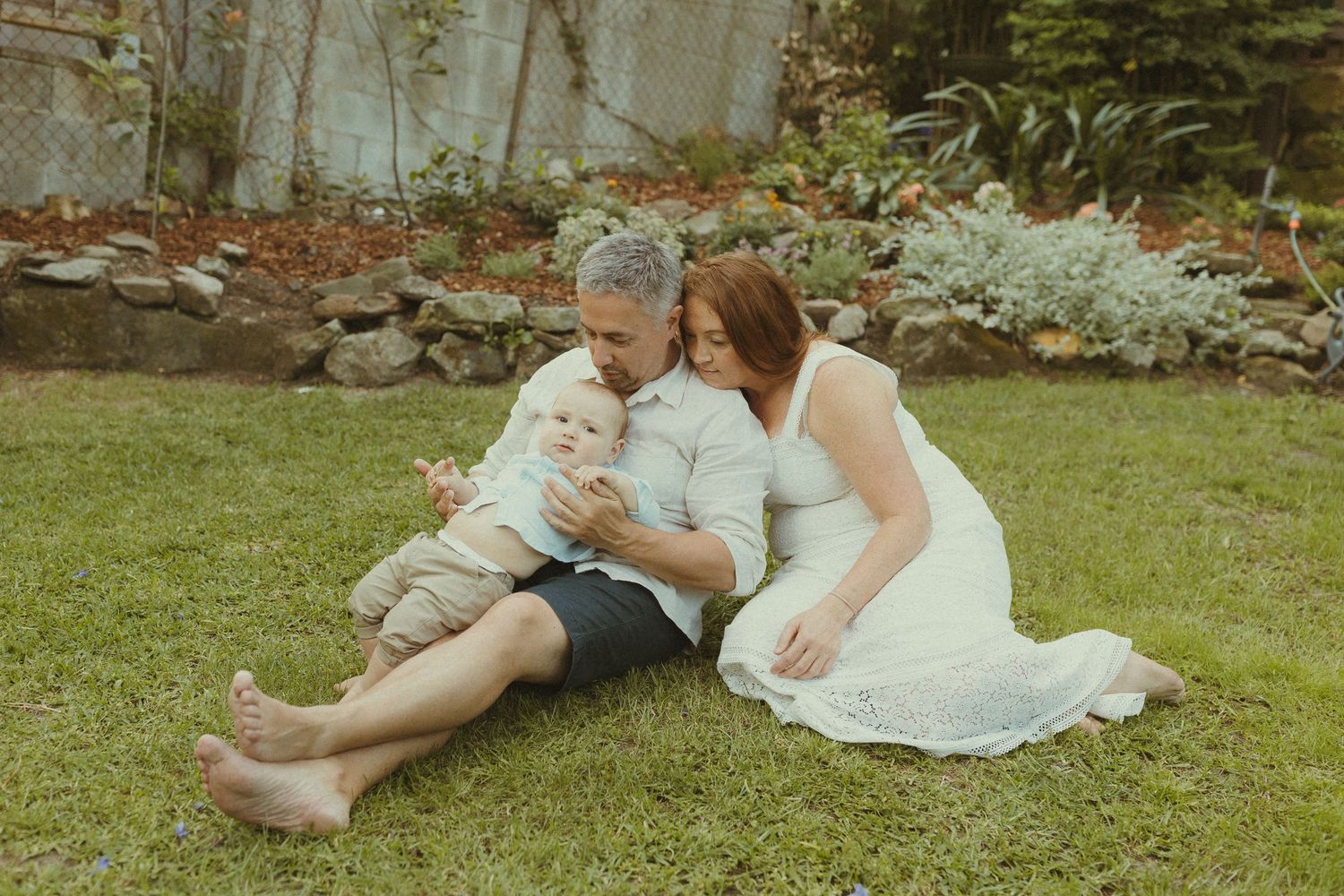Relaxed outdoor photography sequence showing natural interactions on grass.