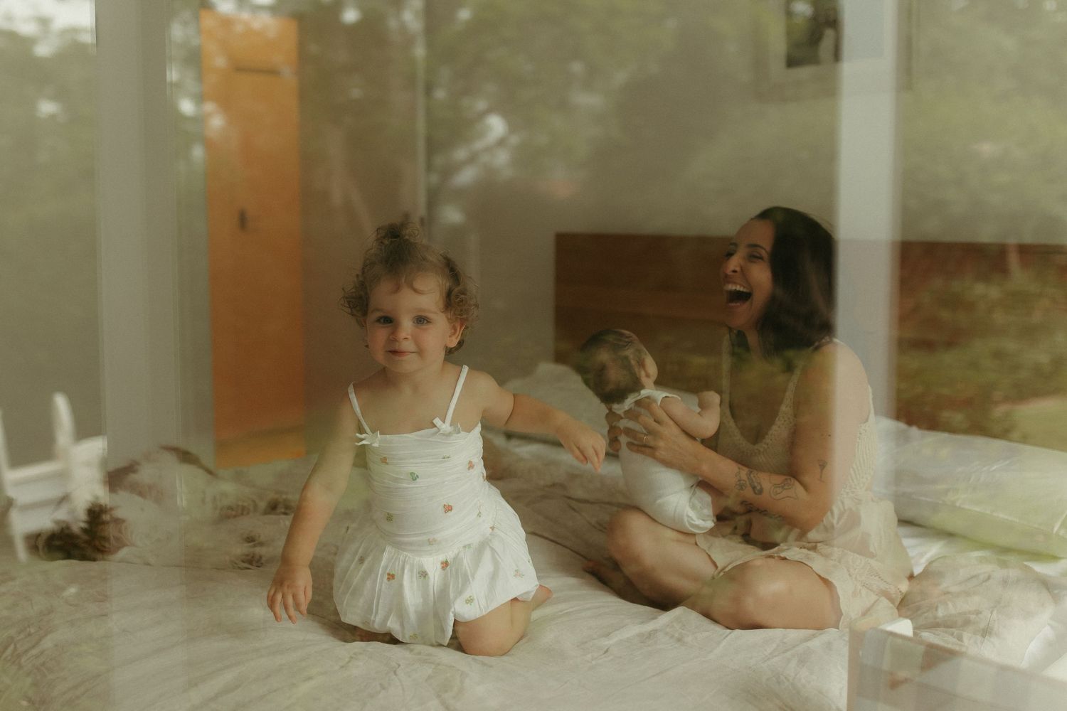A tender indoor moment captured in soft, vintage-style lighting.