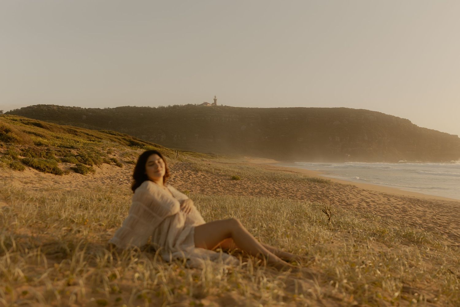A series of beach landscape photos showing a person lying on sandy hills at sunset.
