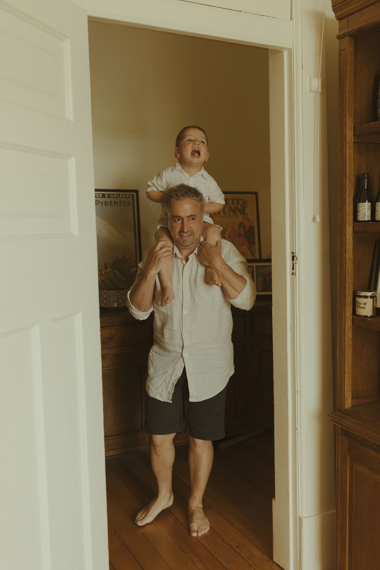A series of candid indoor photos showing playful moments in a hallway.