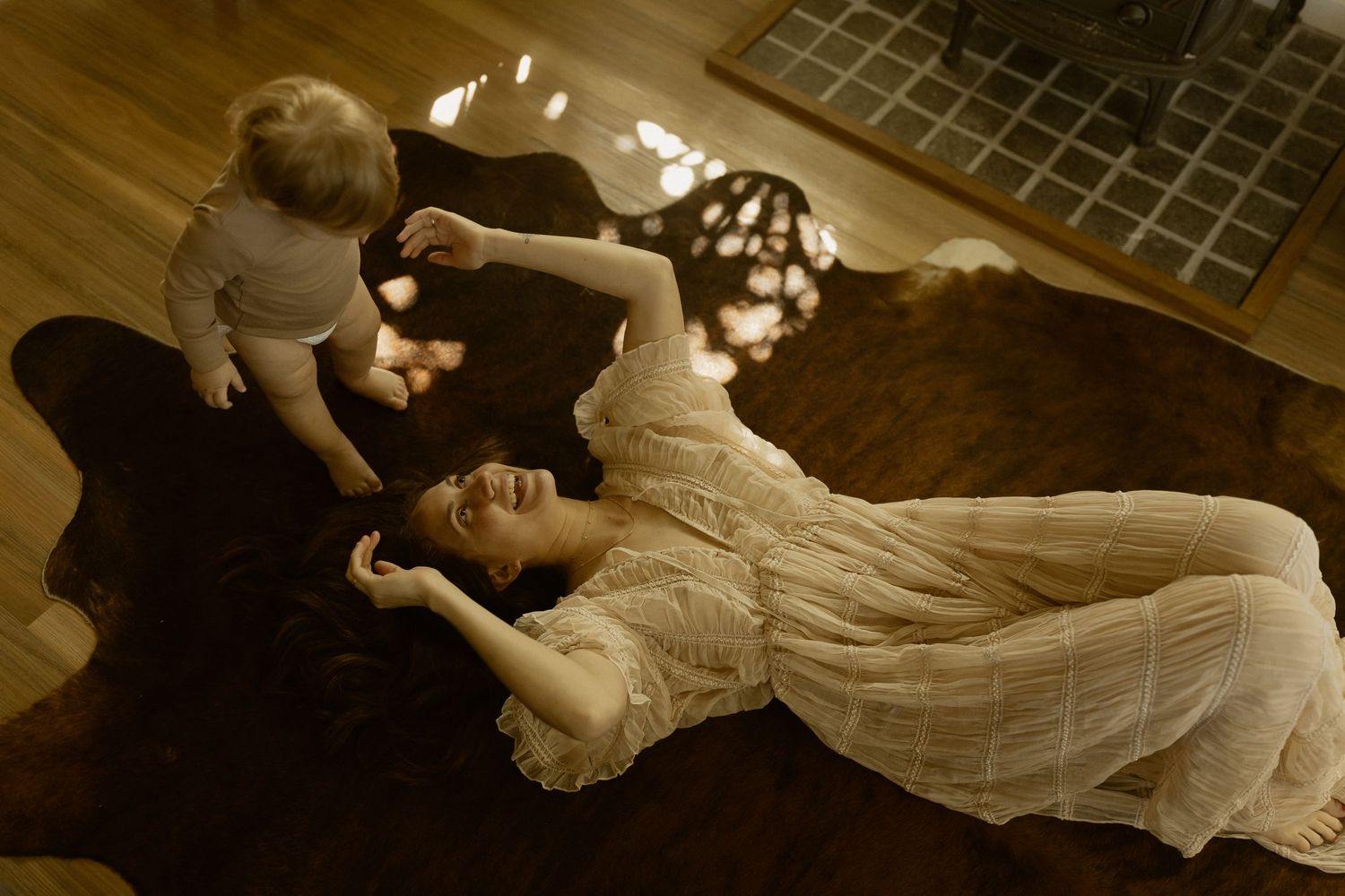 Artistic sequence of movement and dance in sepia tones on wooden floor.