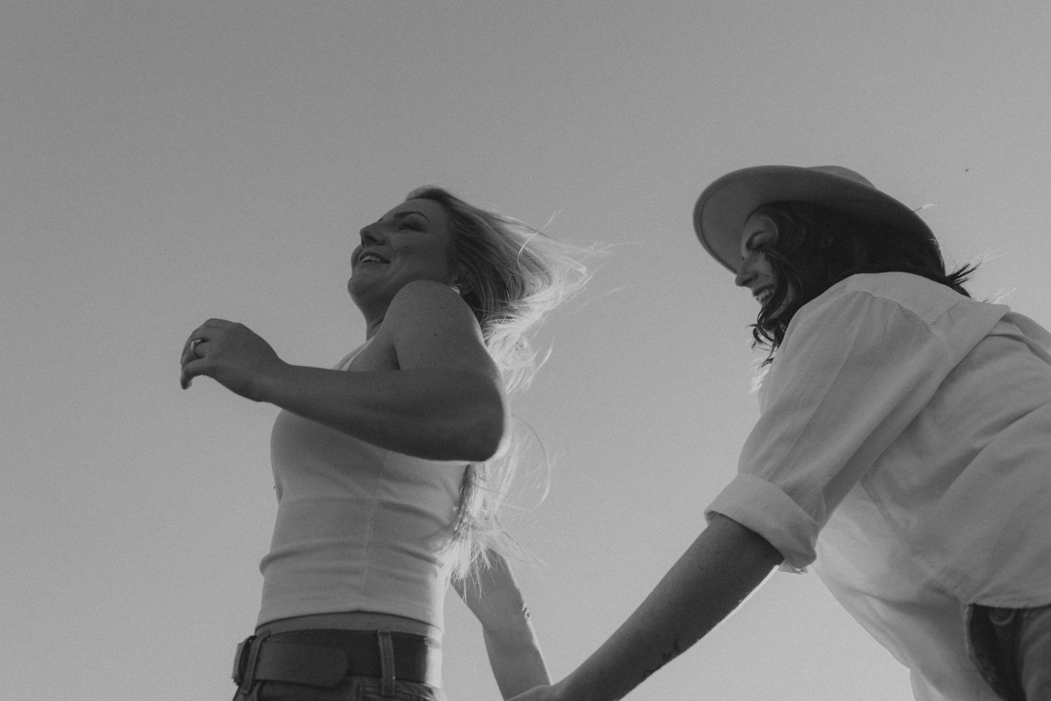 A series of black and white photos showing people engaged in dance movements against a light background.