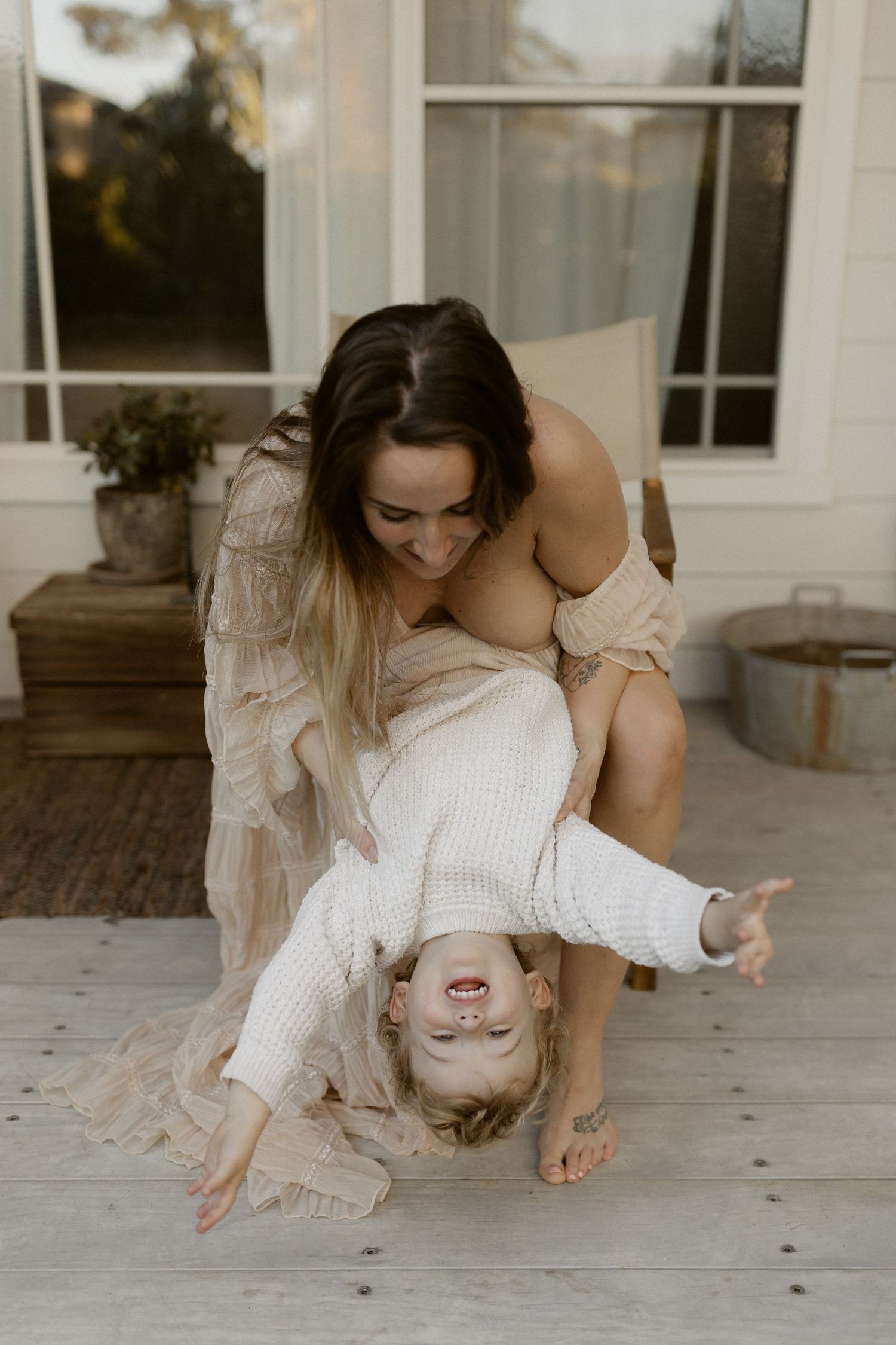 A series of dance-like movements captured in white dress on a porch in artistic motion sequence.