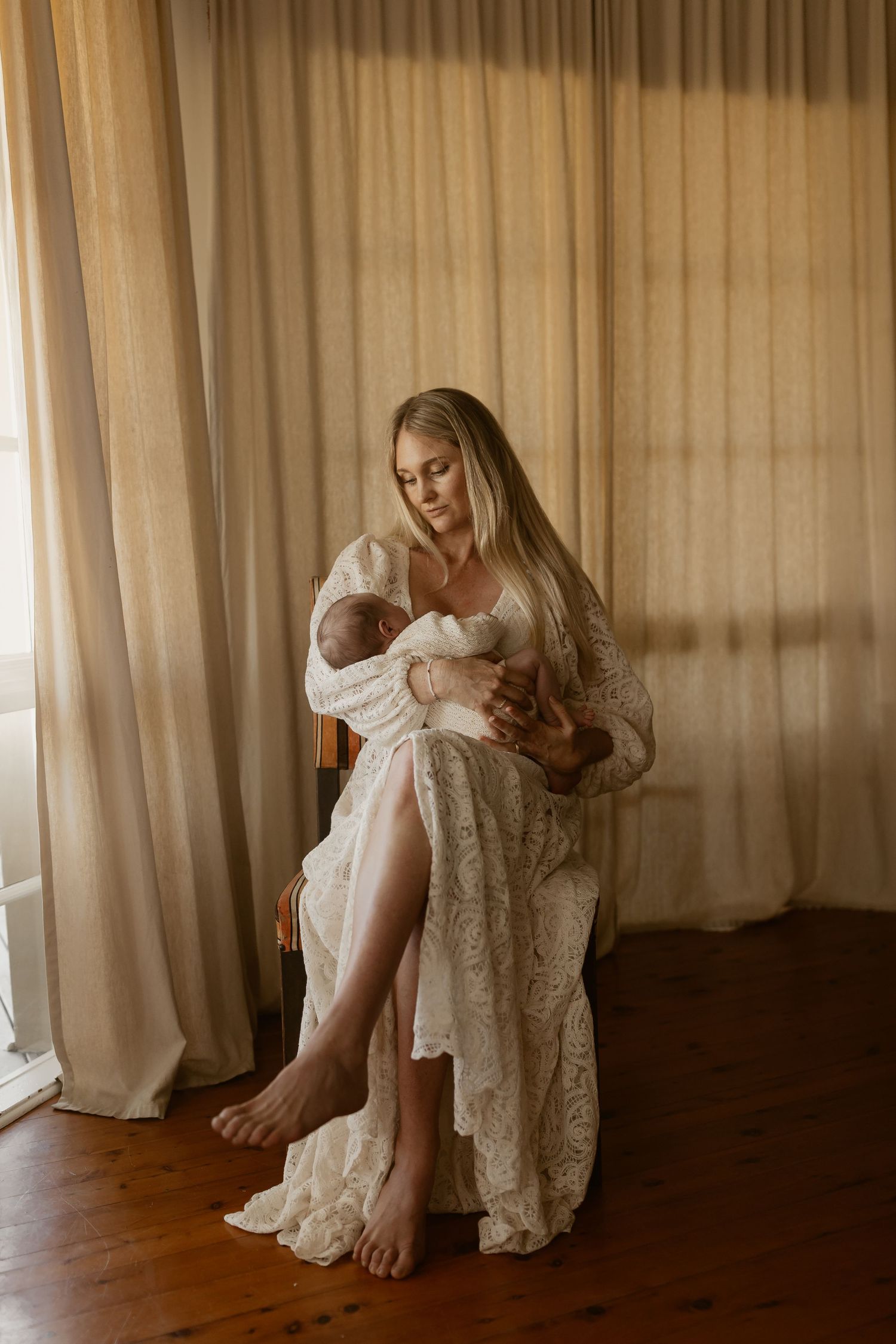 A sequence of photos showing a romantic white lace dress against warm light filtering through sheer curtains.