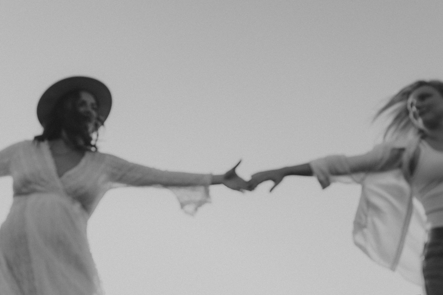 A sequence of black and white photos showing two people dancing together in an expressive performance.