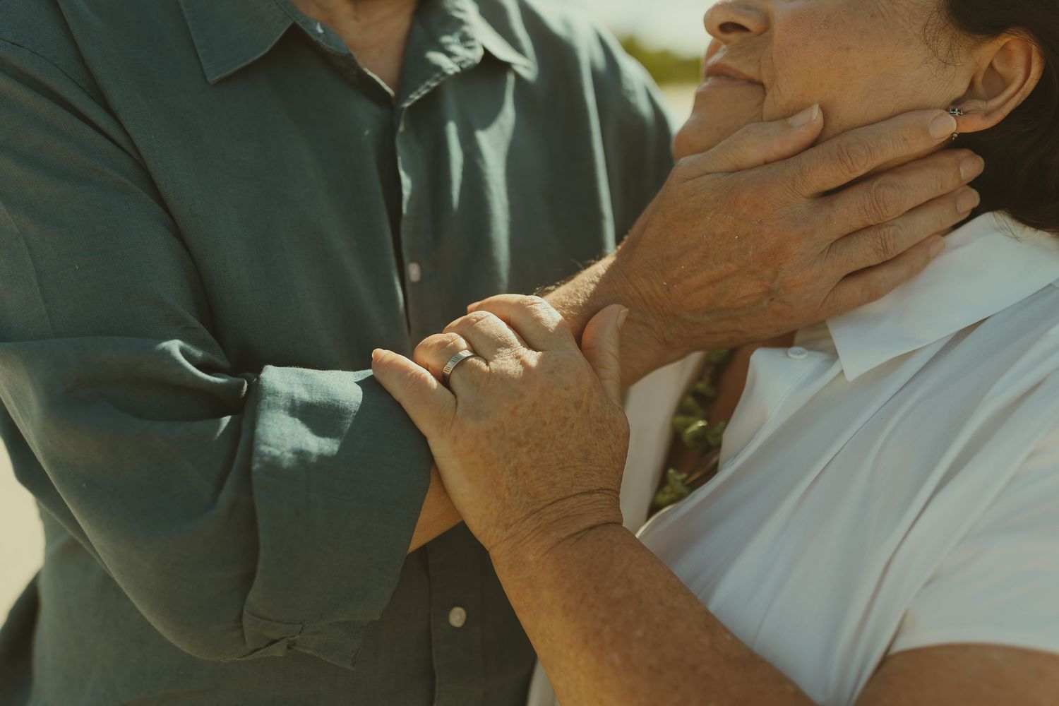 Close-up shots of an intimate embrace between two people showing gentle affection.