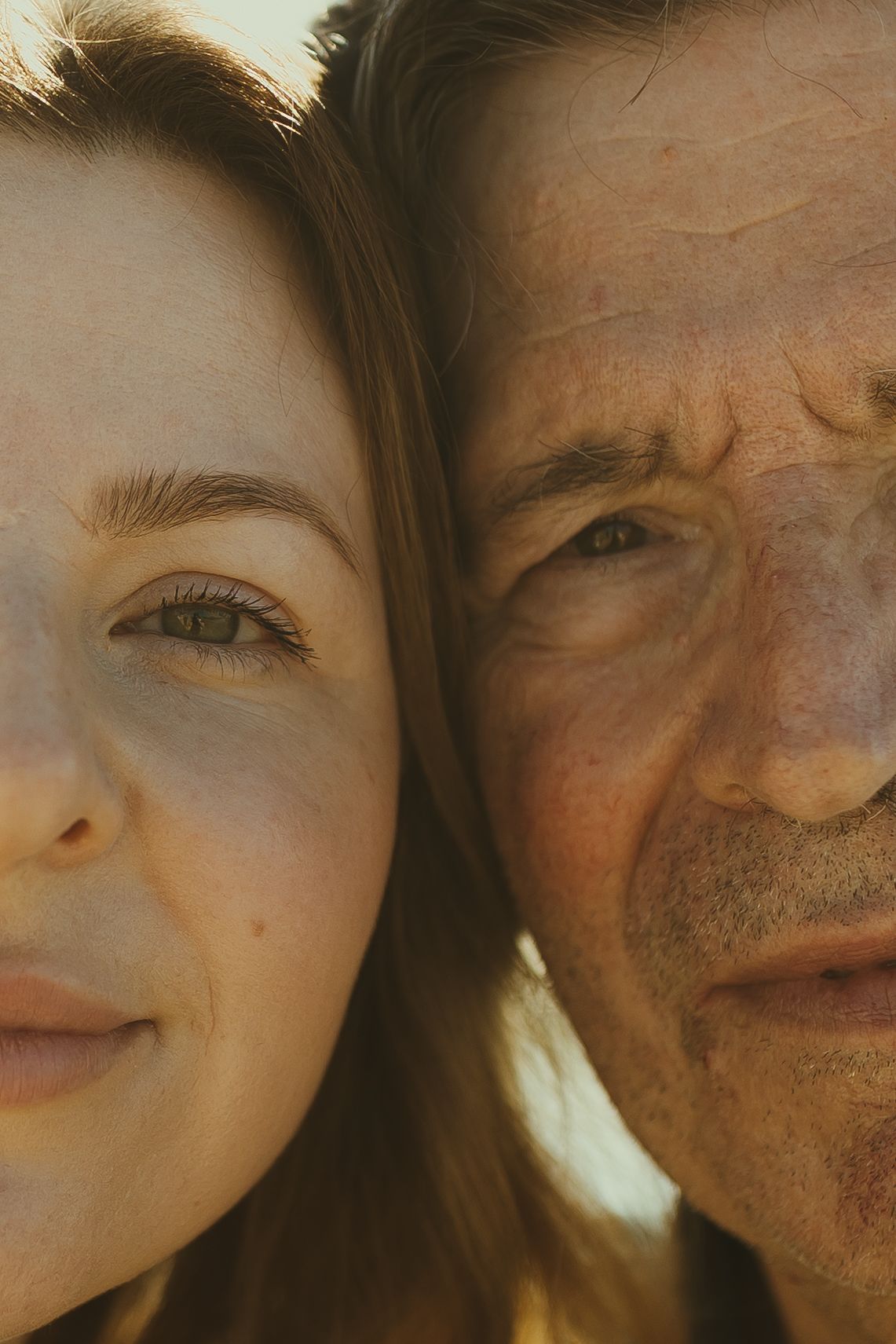 A close-up photo shows a couple smiling together in warm lighting with their faces partially cropped.