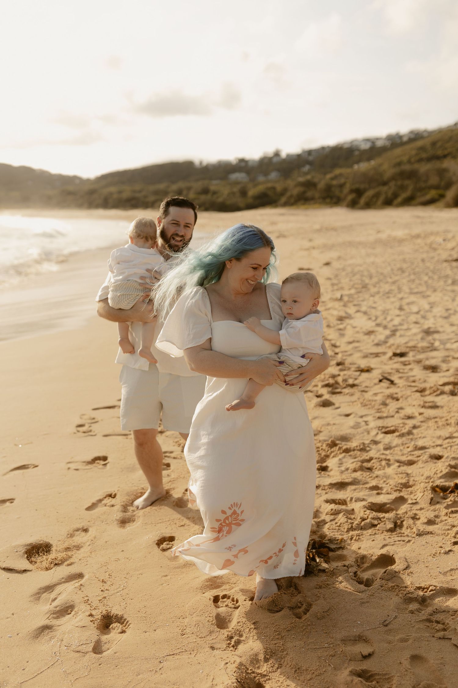 A sequence of photos showing a family playing and running together on a sandy beach at sunset.