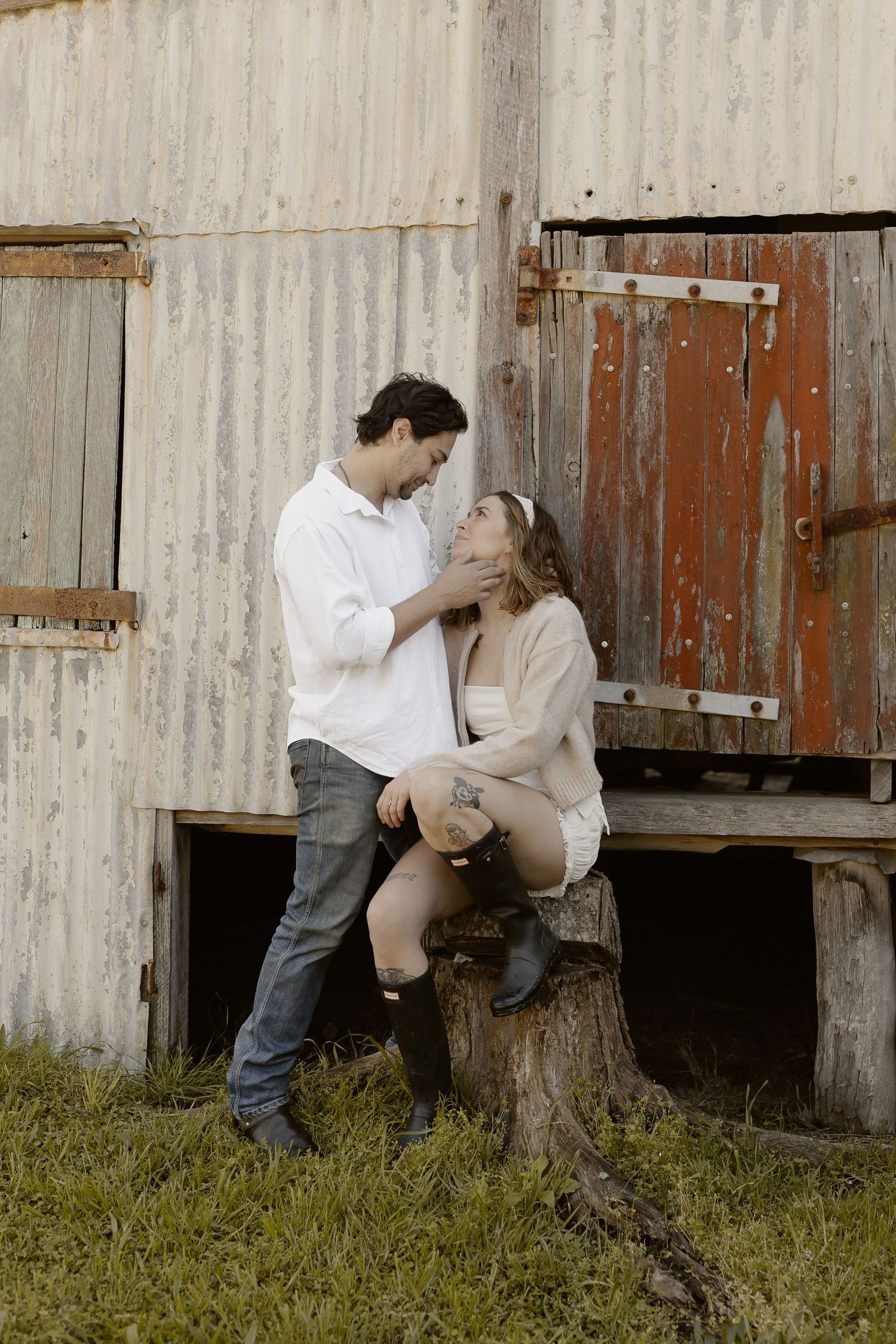 Romantic film strip sequence of a couple embracing against a rustic barn wall.