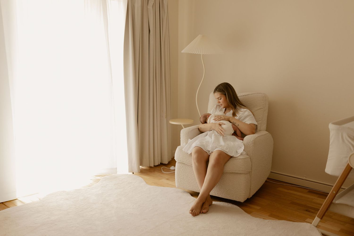 Minimalist home interior scene with soft beige tones and natural window light.