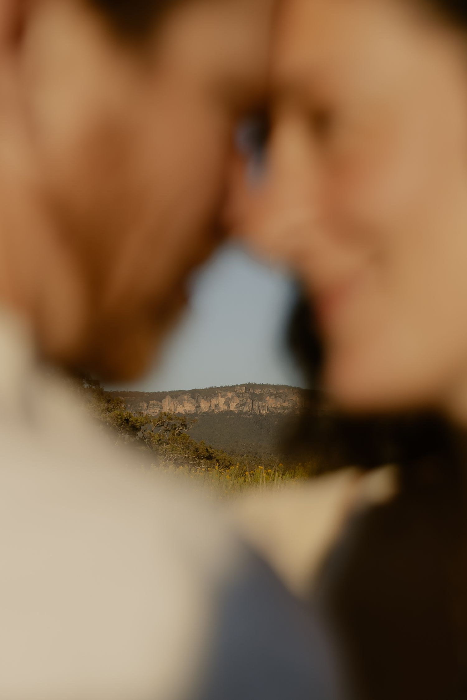 An intimate close-up portrait with warm tones and soft focus.