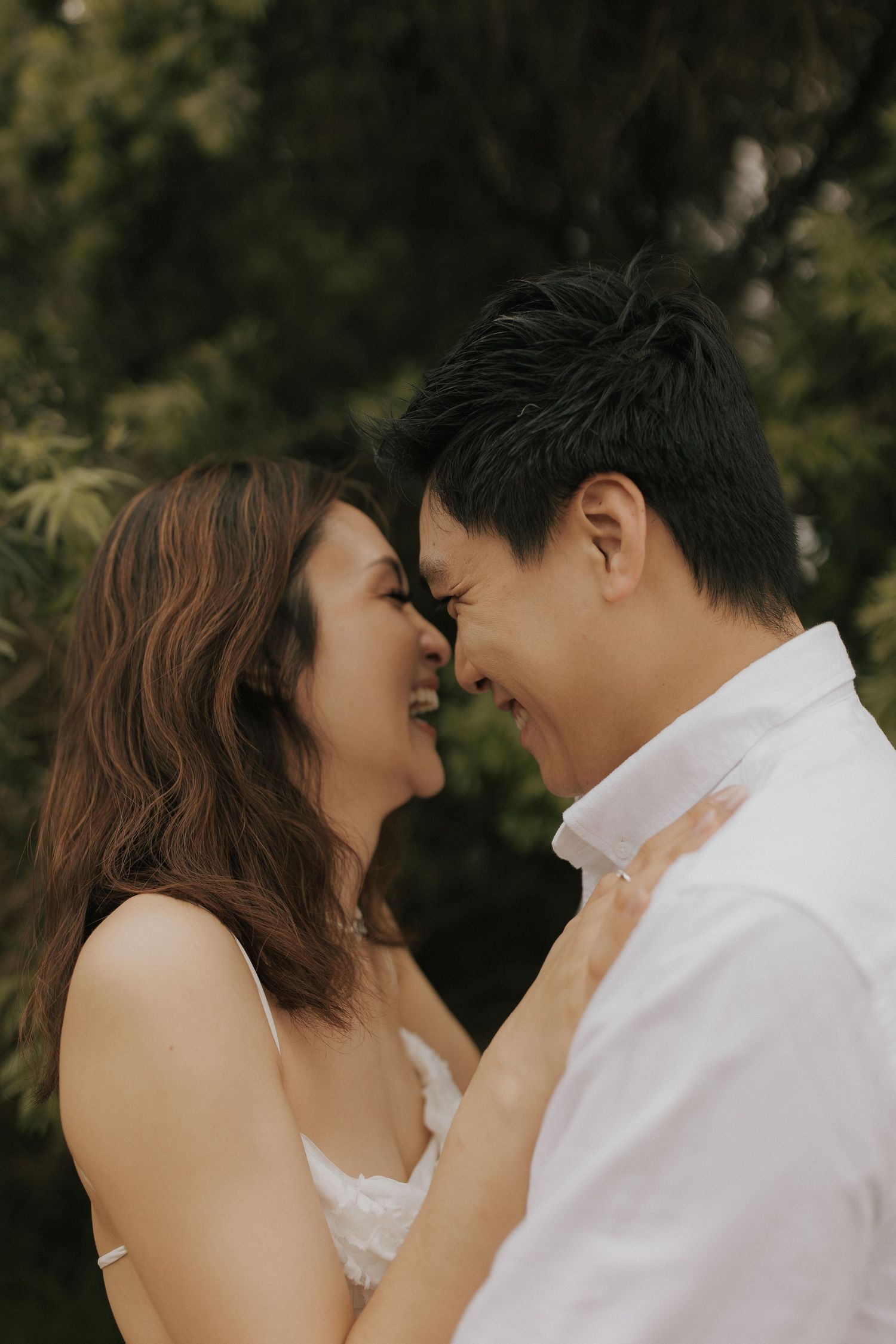 A romantic couple shares intimate close-up moments in a series of tender poses outdoors.