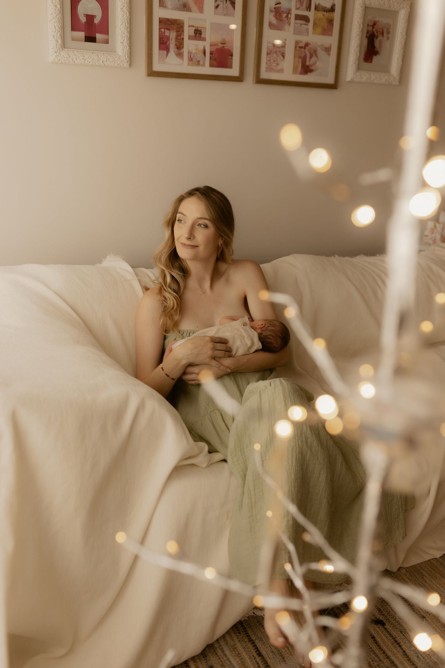 Dreamy nursery scene with string lights and soft natural window light creating a cozy atmosphere.