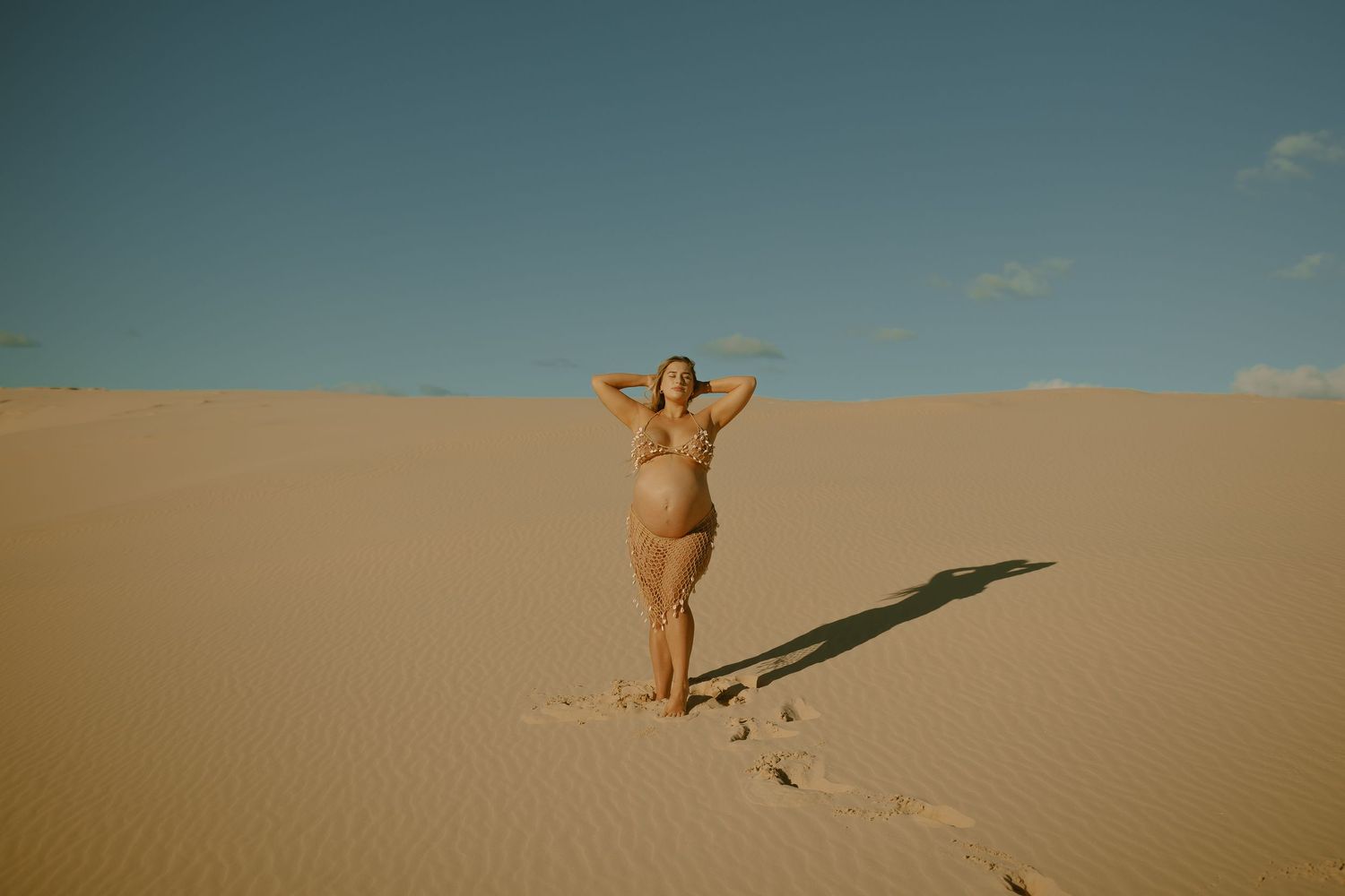 Skateboarding sequence captured across multiple frames showing progression of moves in sandy desert terrain.