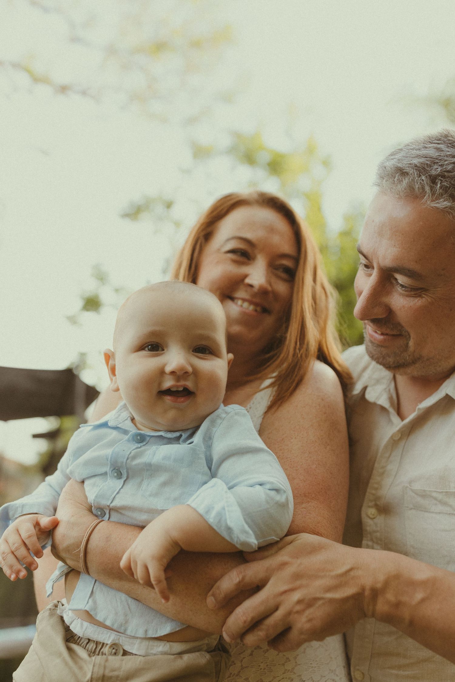 Candid family moments captured in warm natural lighting showing genuine joy and connection.