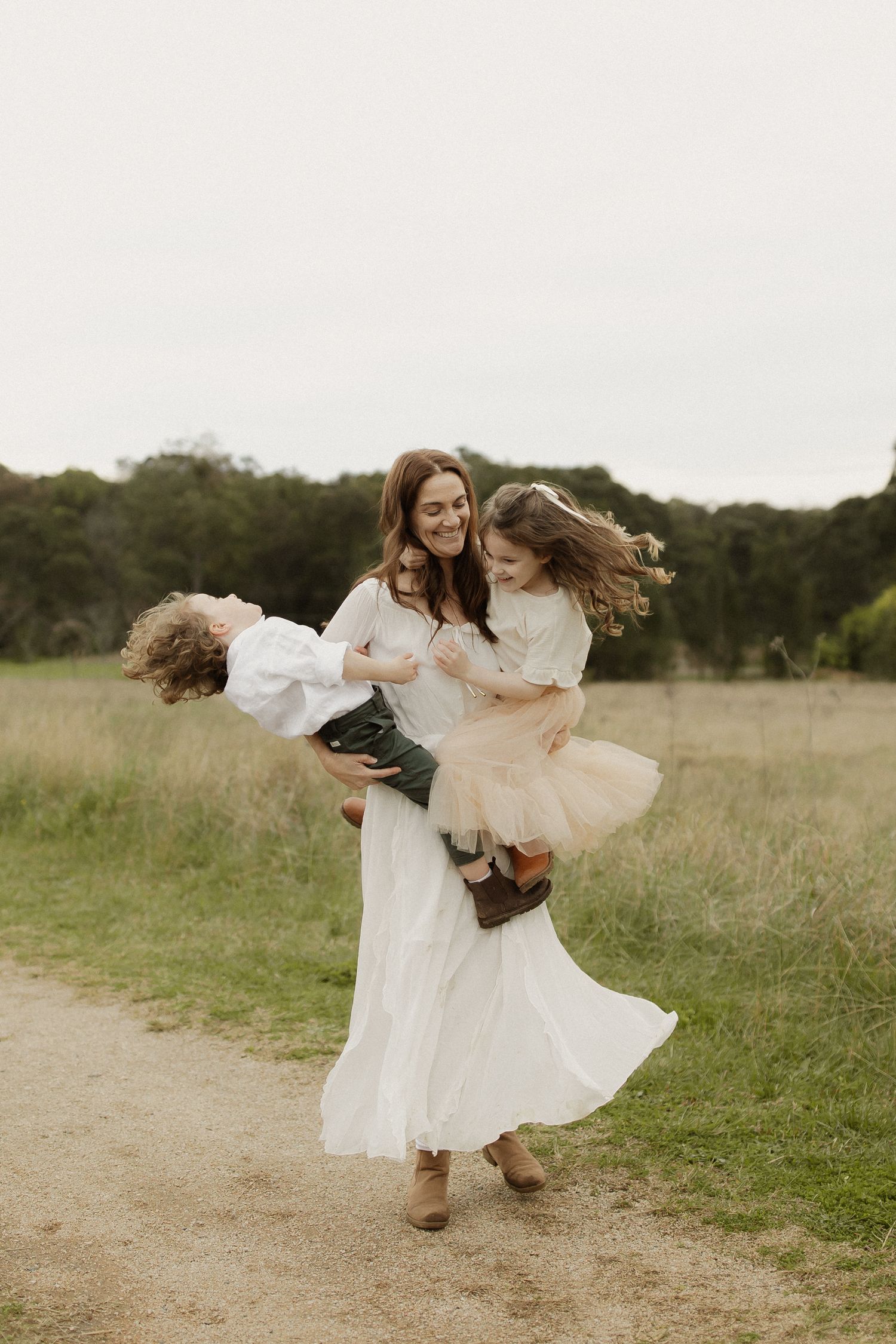 A playful moment captured as someone spins and dances on a countryside path.