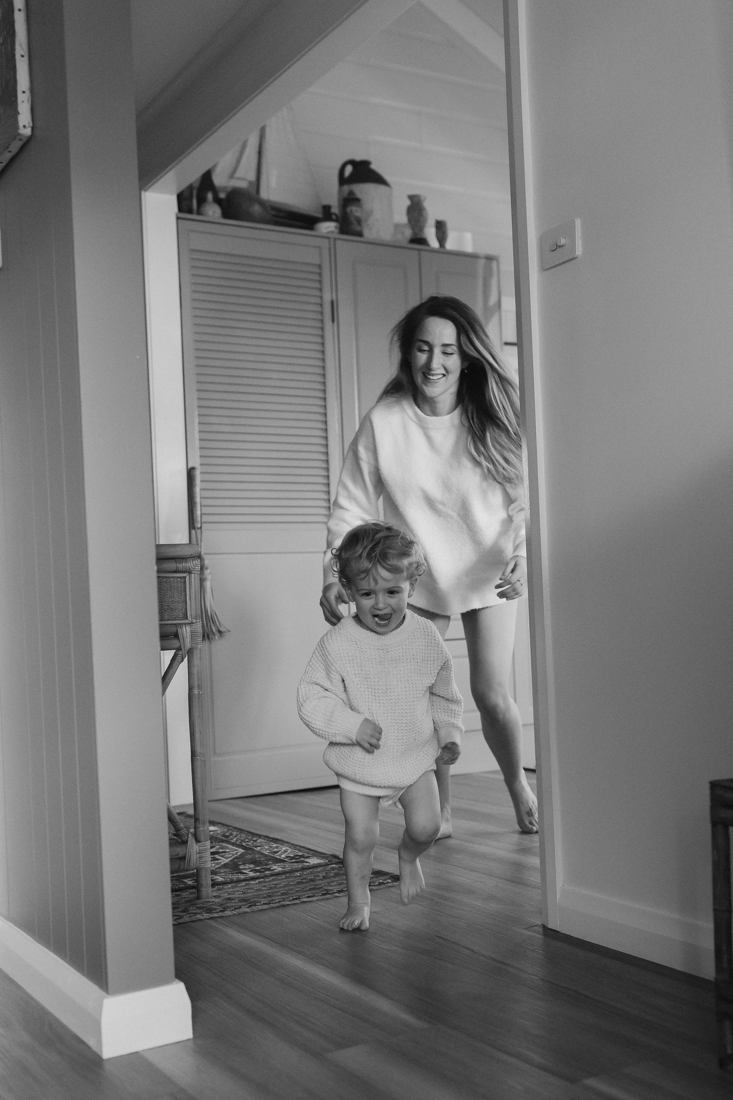 Energetic series of people playing and jumping indoors wearing white clothing.